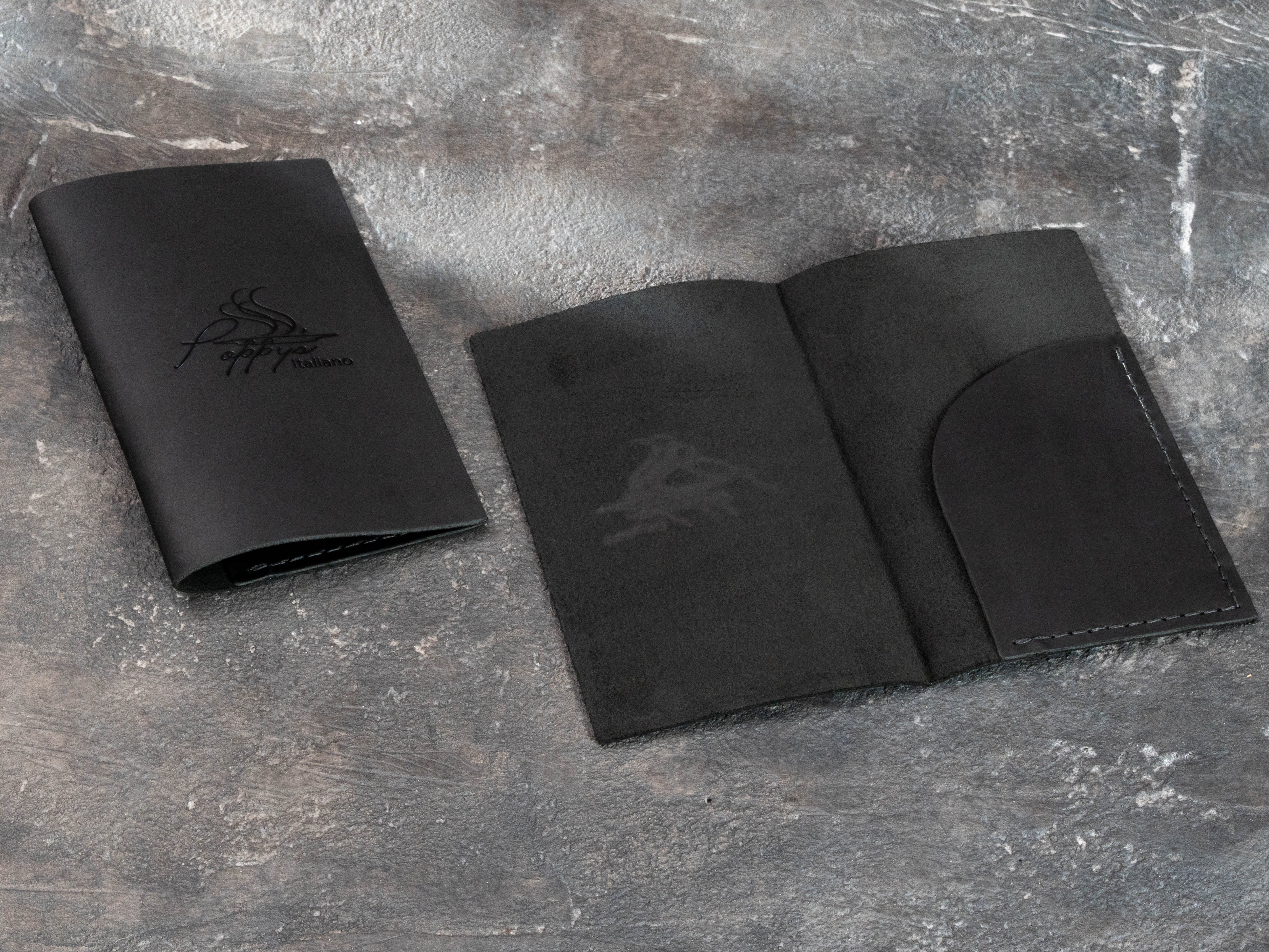 Black leather guest check folder shown open with curved interior payment pocket for receipts, cards and cash.