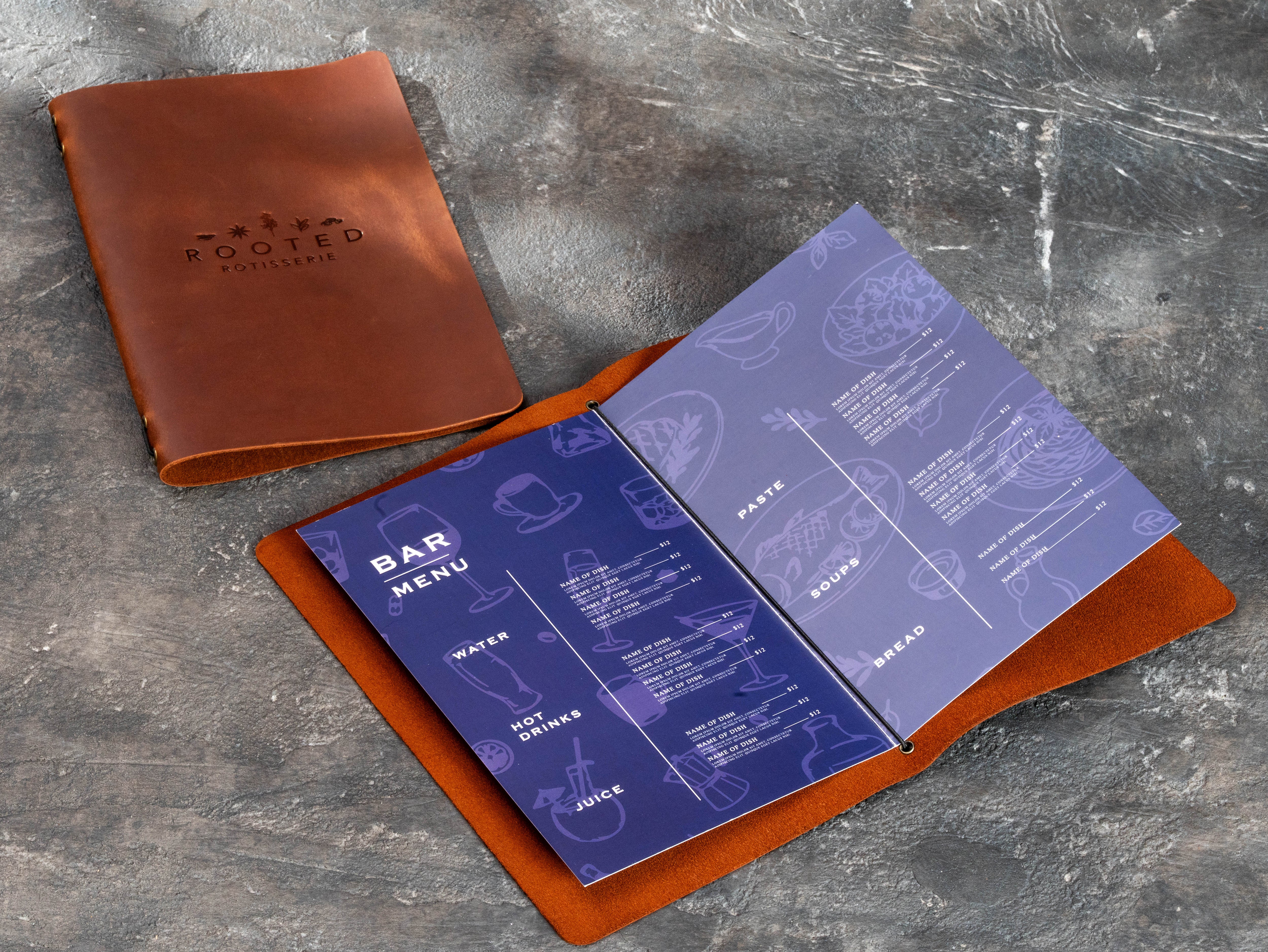 Interior view of leather restaurant menu cover with two printed pages secured by an elastic cord