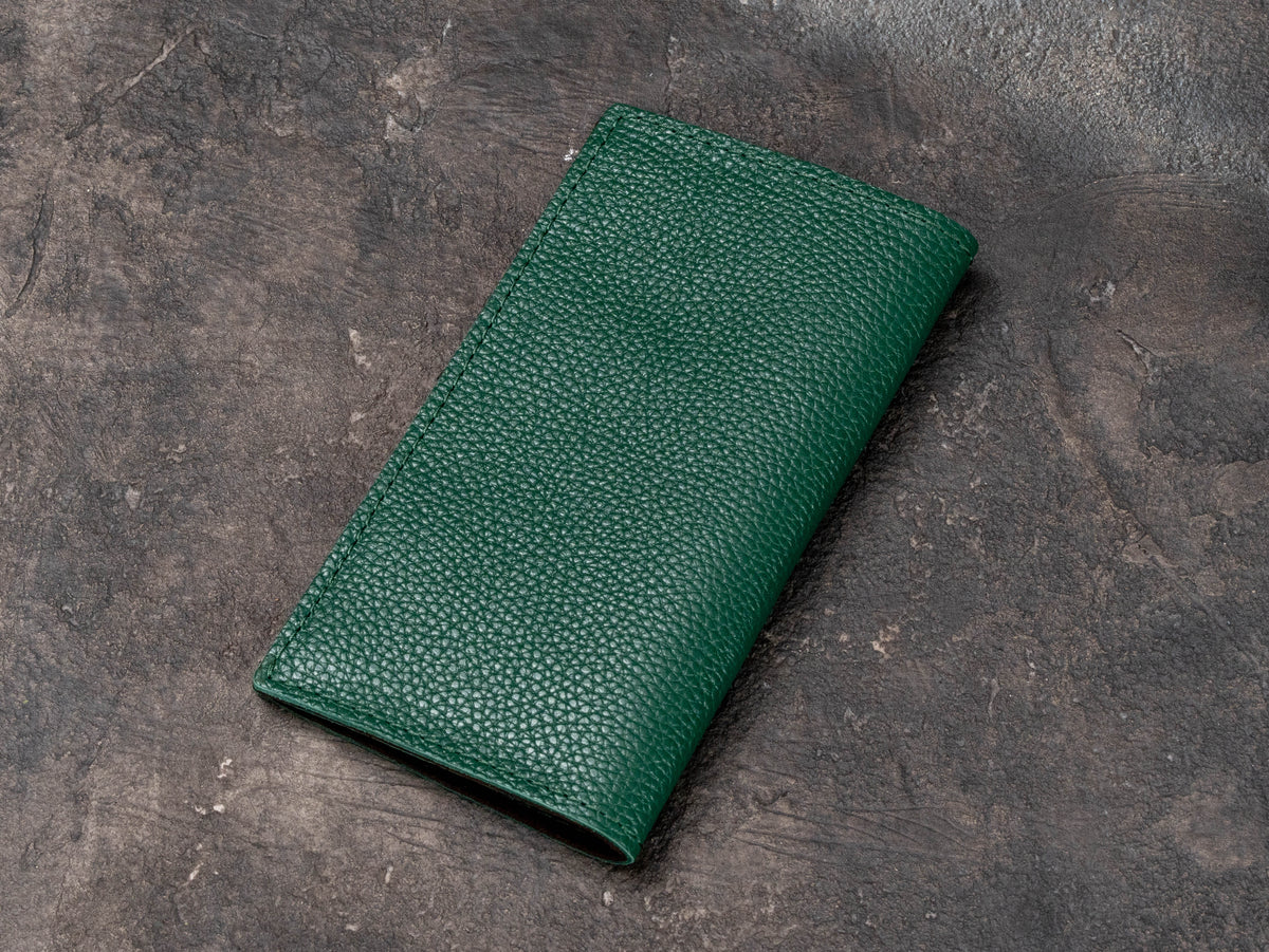 Back view of green two-layer leather check presenter with textured floater leather exterior