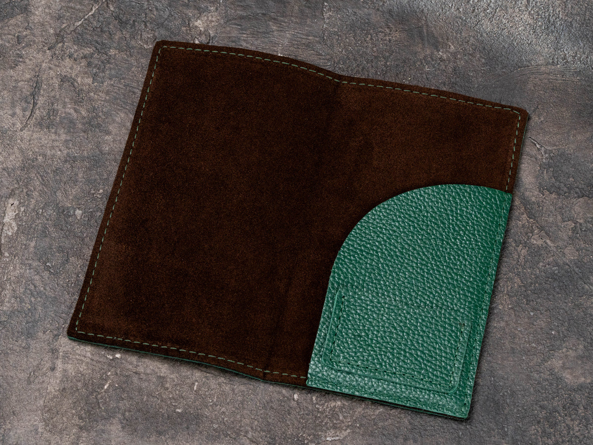 Open leather restaurant bill presenter with suede interior and curved pocket detail
