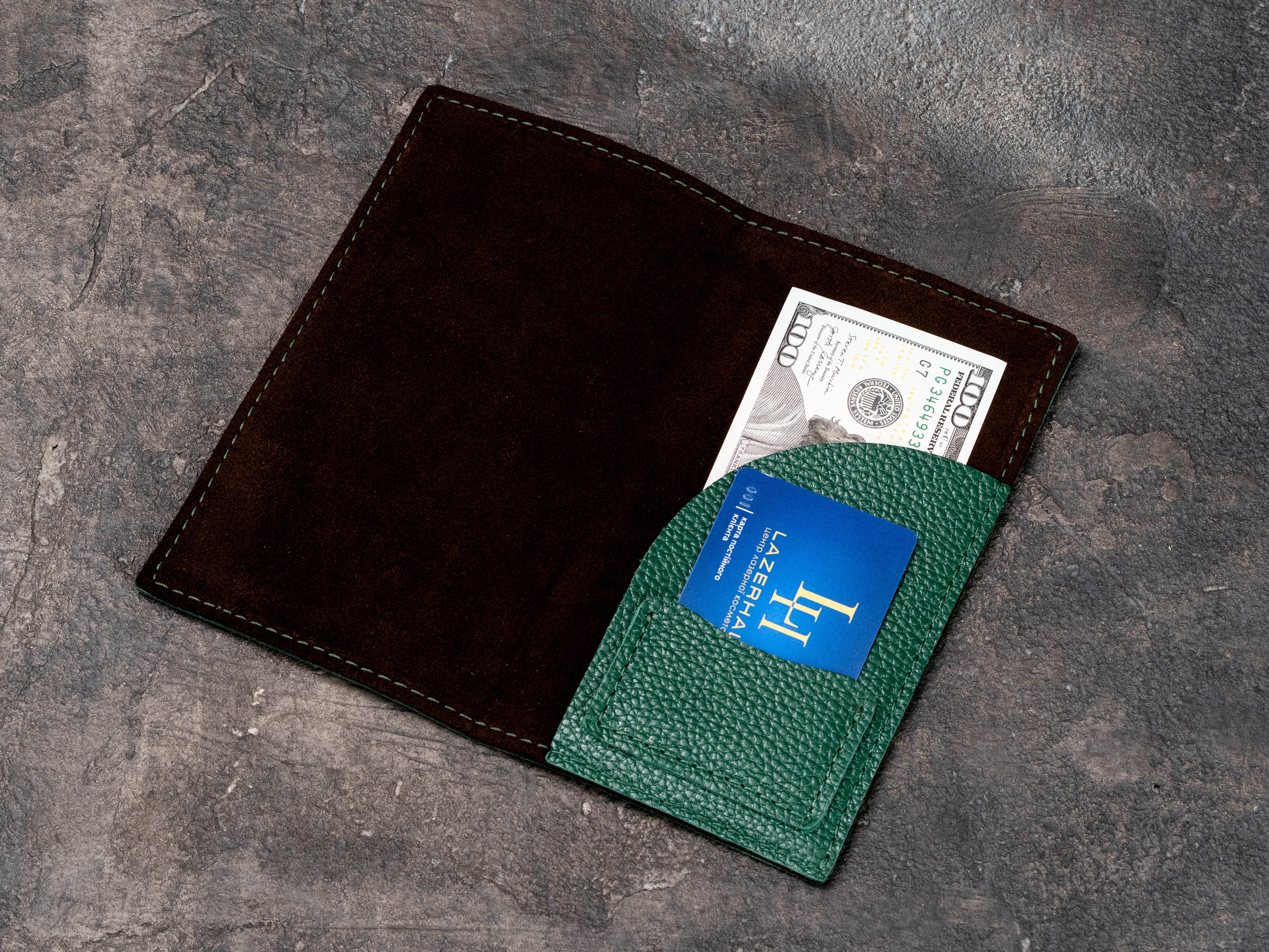 Custom leather restaurant check presenter with suede interior holding dollar bill and business card