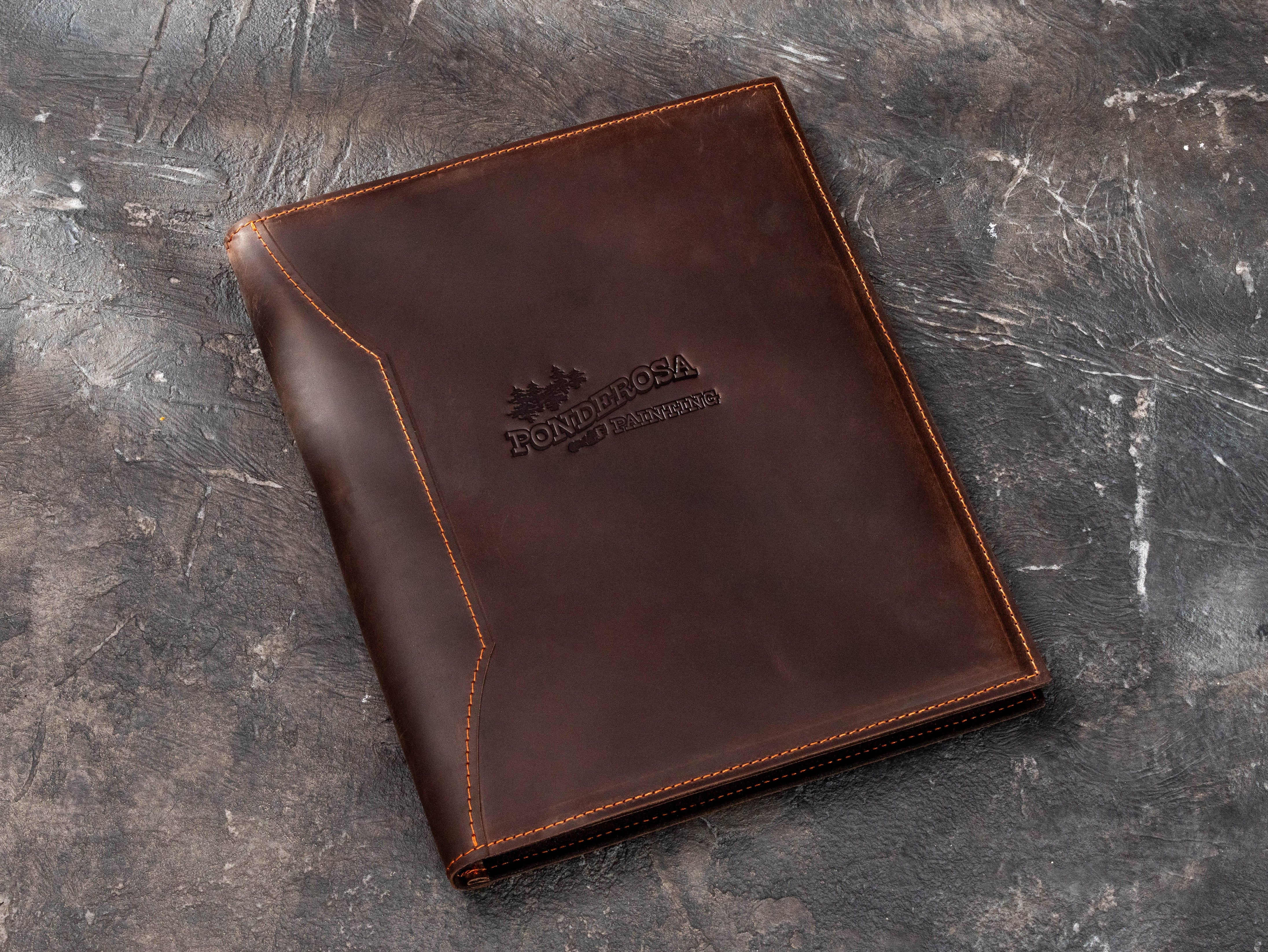 Personalized brown leather business padfolio with custom company logo, designed for contractors, consultants and professional corporate use.