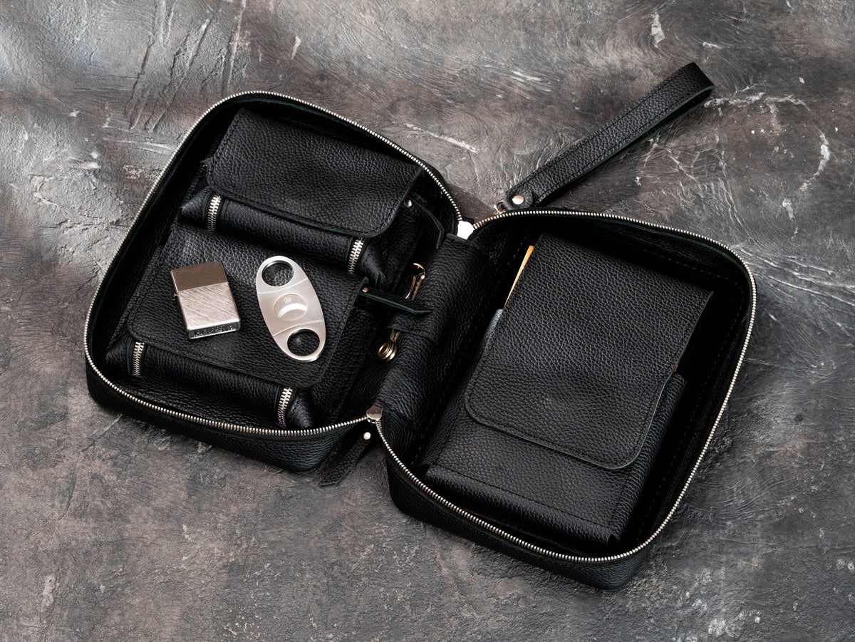 Premium leather cigar club organizer with separate accessory pockets, magnetic flaps, cigar compartment and removable wrist strap.
