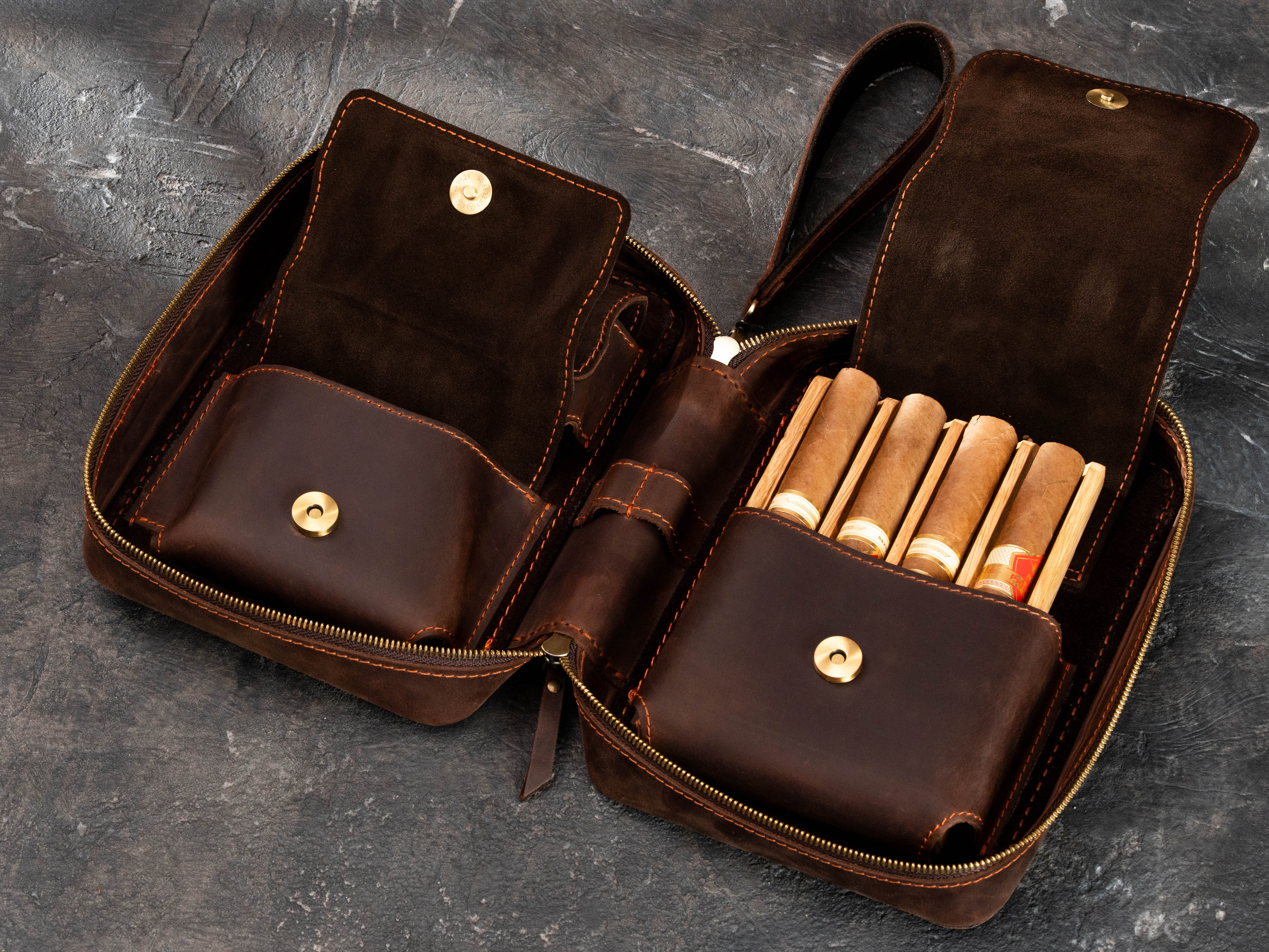 Open personalized cigar organizer with four-cigar oak tray, magnetic accessory pockets, sculpted leather flaps and suede lining.