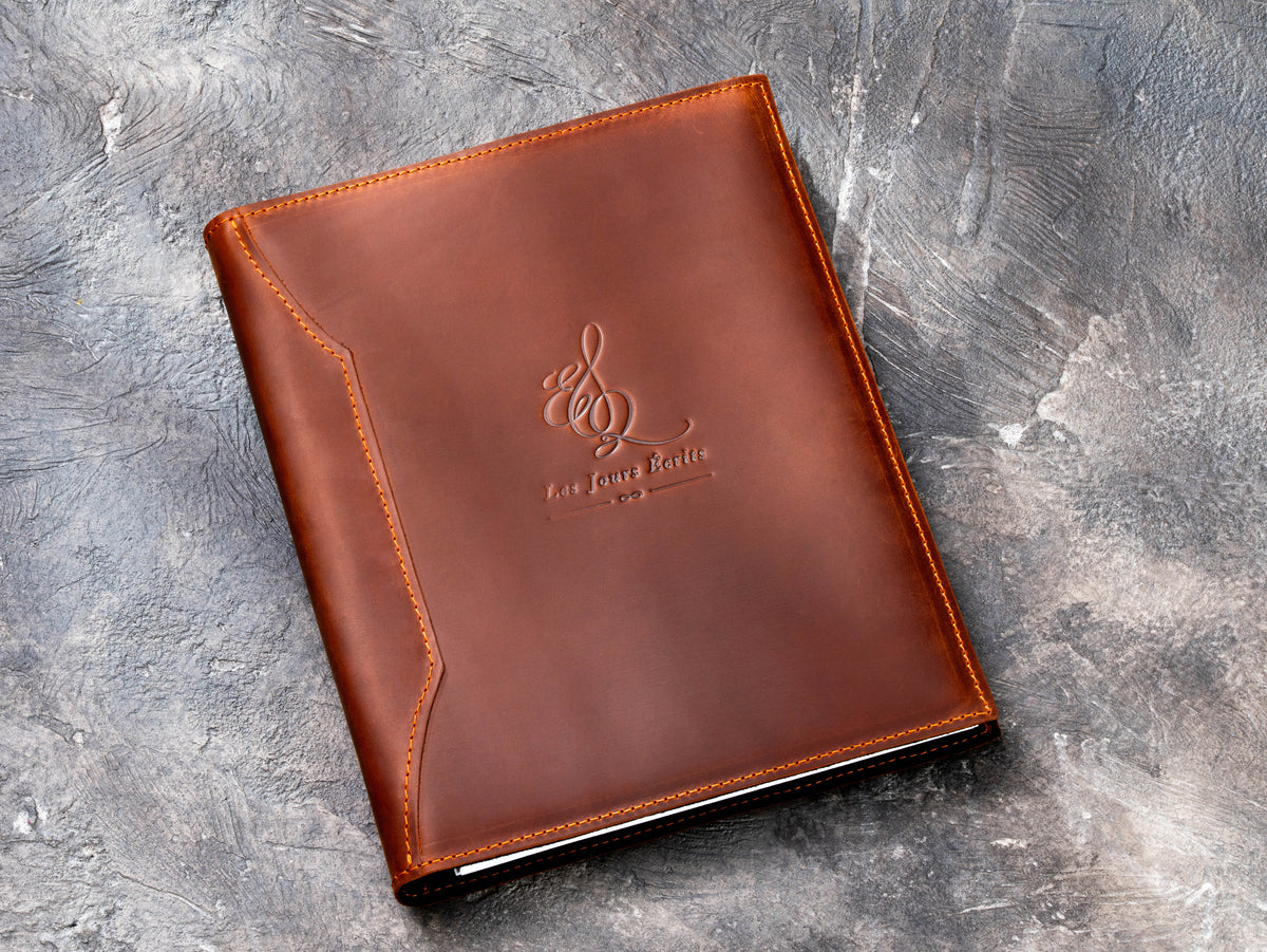 Personalized leather client presentation binder with custom embossed logo on front cover