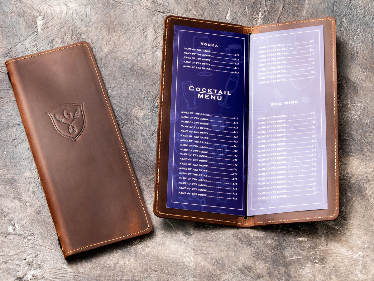 Brown leather wine list and cocktail menu holder with elastic cord binding and custom crest logo