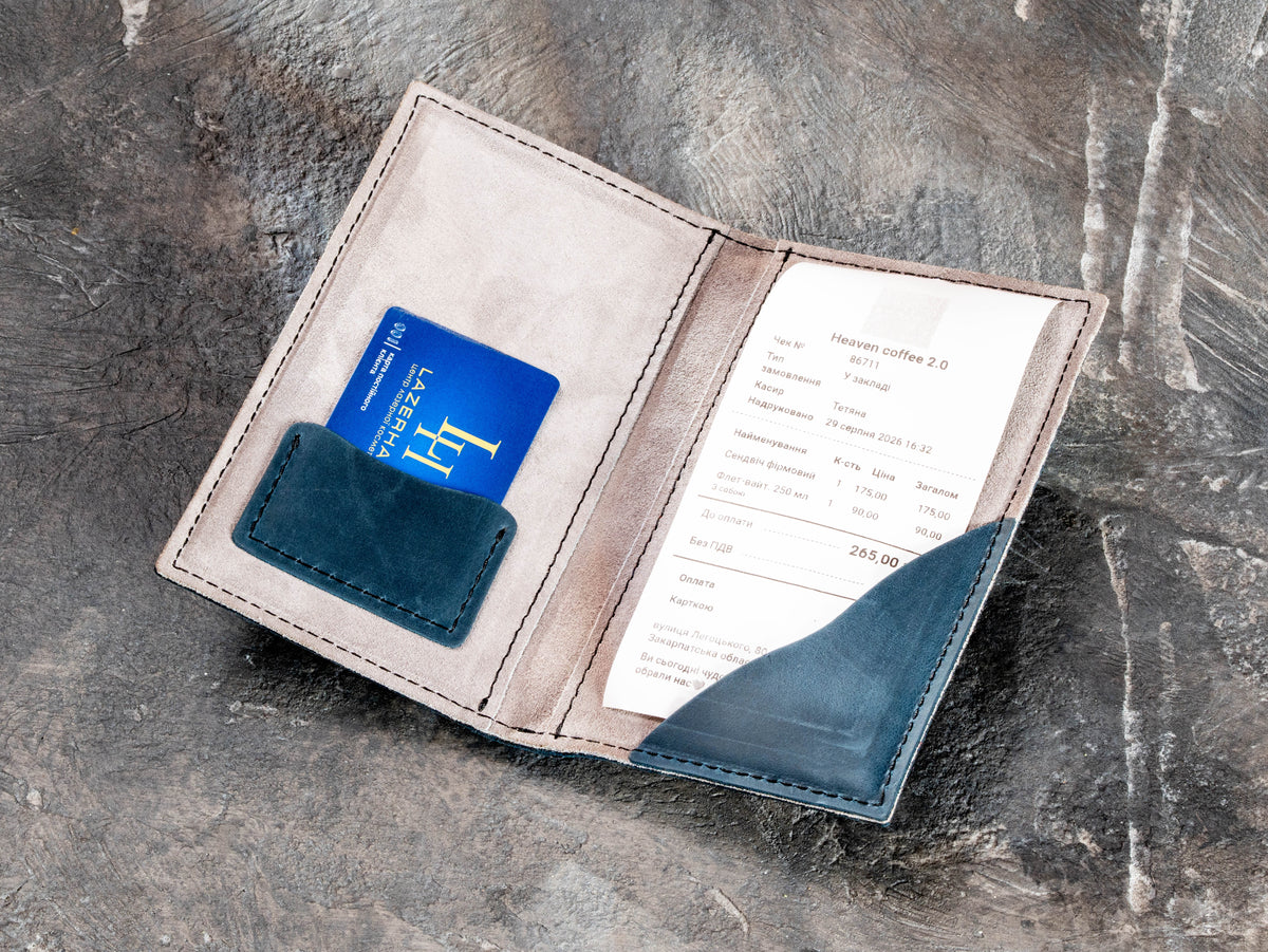 Open navy leather guest check folder with suede interior, card pocket and receipt holder