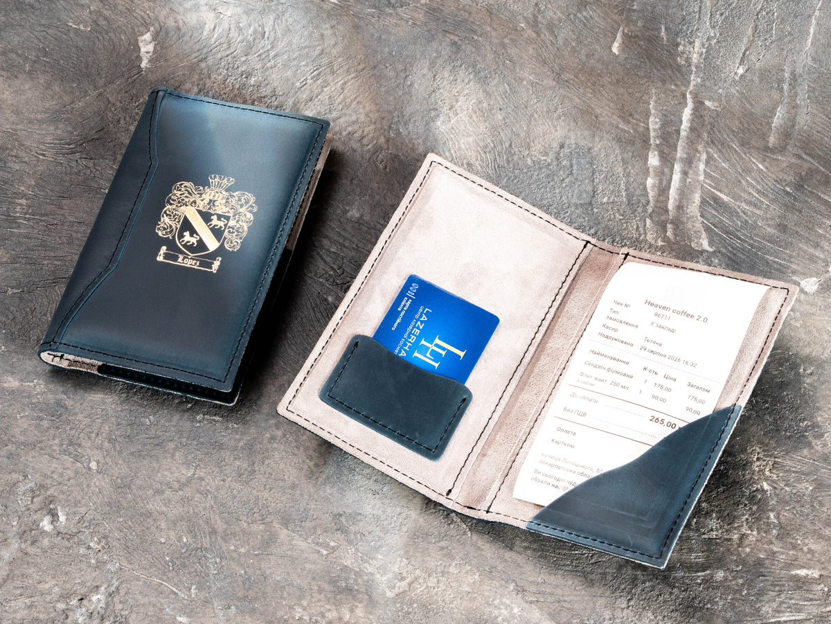 Custom leather payment folder shown open and closed with gold crest logo and card pocket