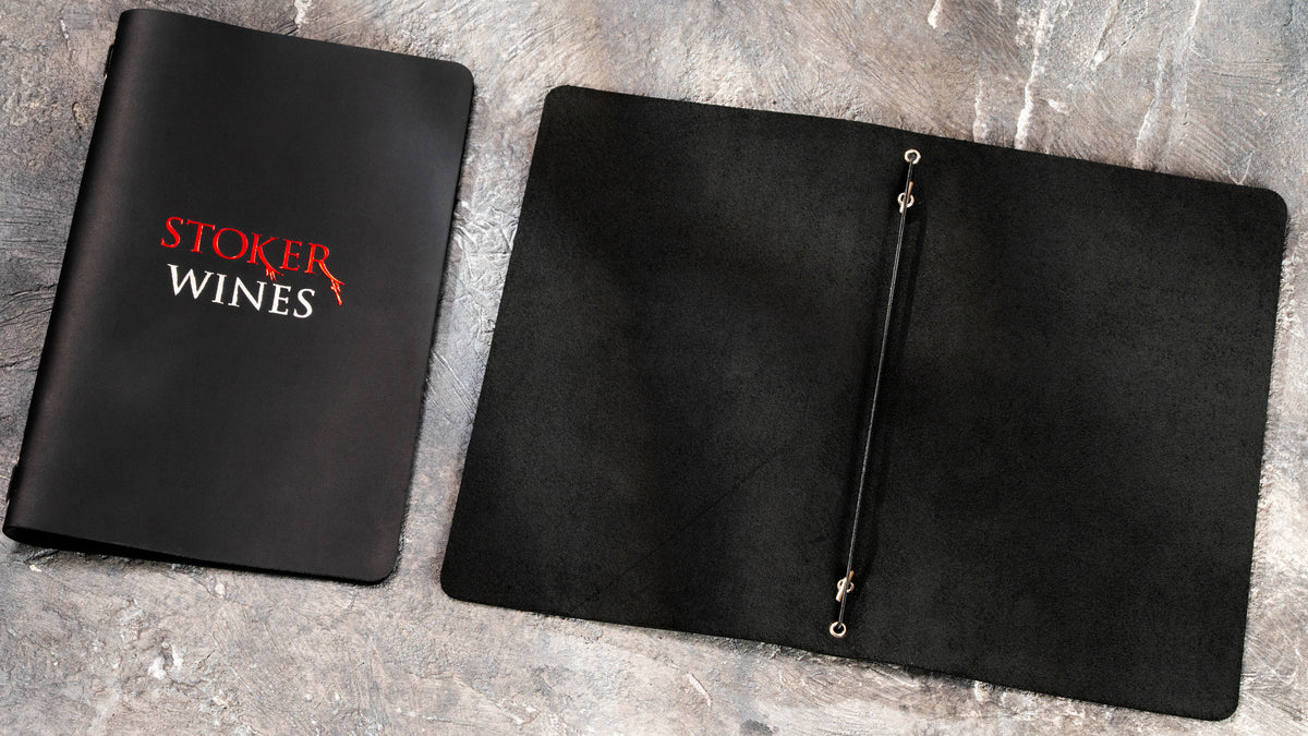 Black single-layer leather menu cover with a natural suede reverse and central elastic cord