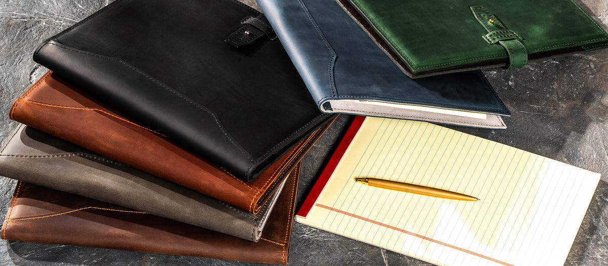Personalized leather portfolios and padfolios in multiple colors with legal pad and pen for business and corporate gifts