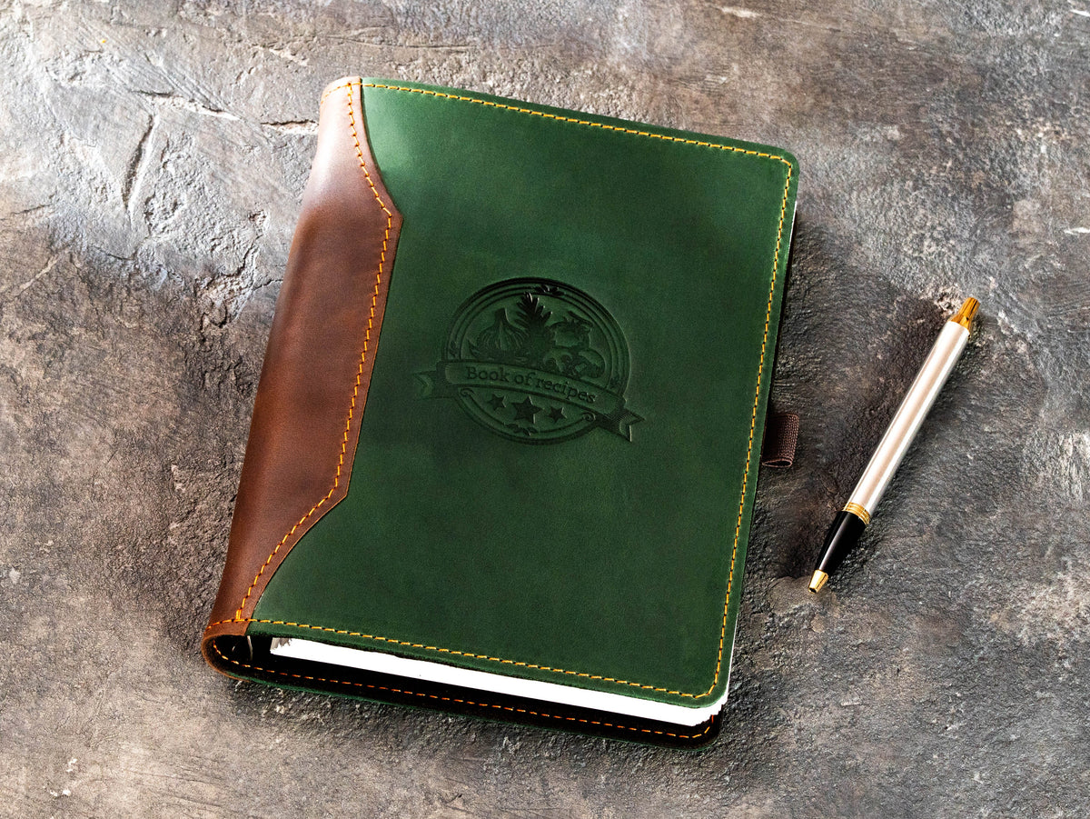 Green Crazy Horse leather personal cookbook organizer with brown spine and embossed recipe emblem