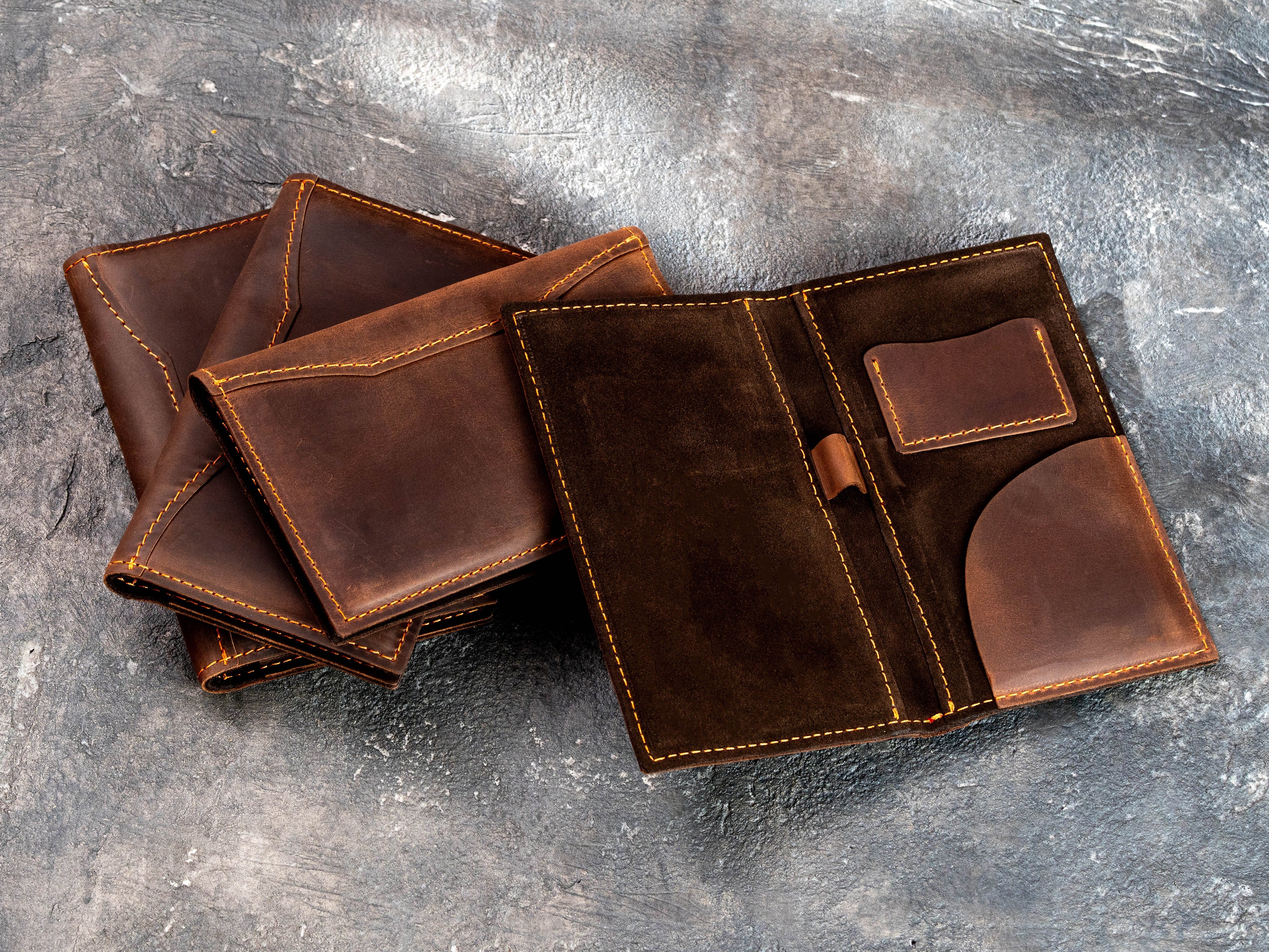 Premium brown leather check presenters with cash, card, bill, and pen pockets for restaurants