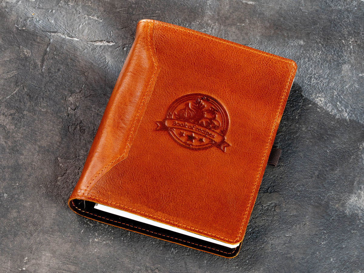 Camel leather recipe keeper with fixed Book of Recipes vegetable emblem and stitched cover
