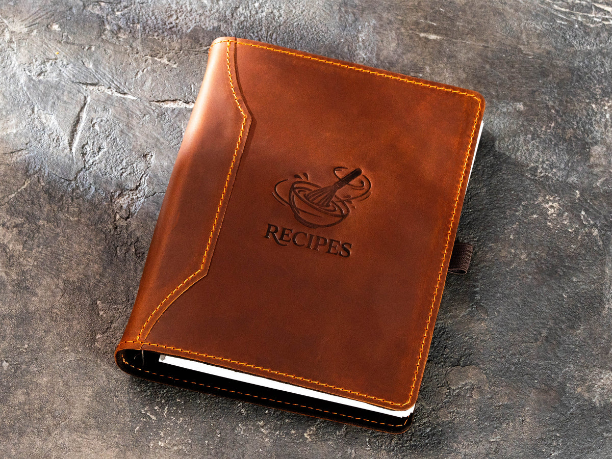 Leather recipe journal in Copper Crazy Horse leather with embossed whisk and Recipes design