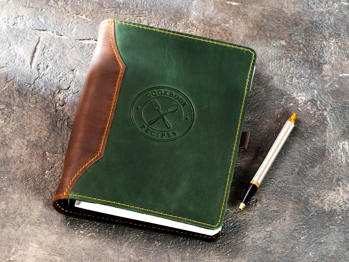 Green and brown Crazy Horse leather recipe organizer with embossed Cookbook Recipes design and pen