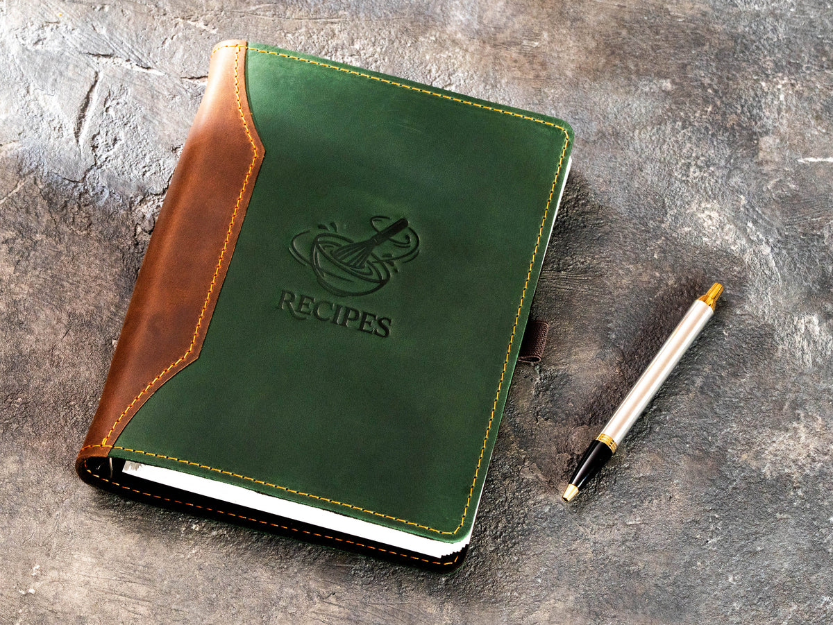 Two-tone leather kitchen recipe organizer with Recipes bowl and whisk emblem and pen
