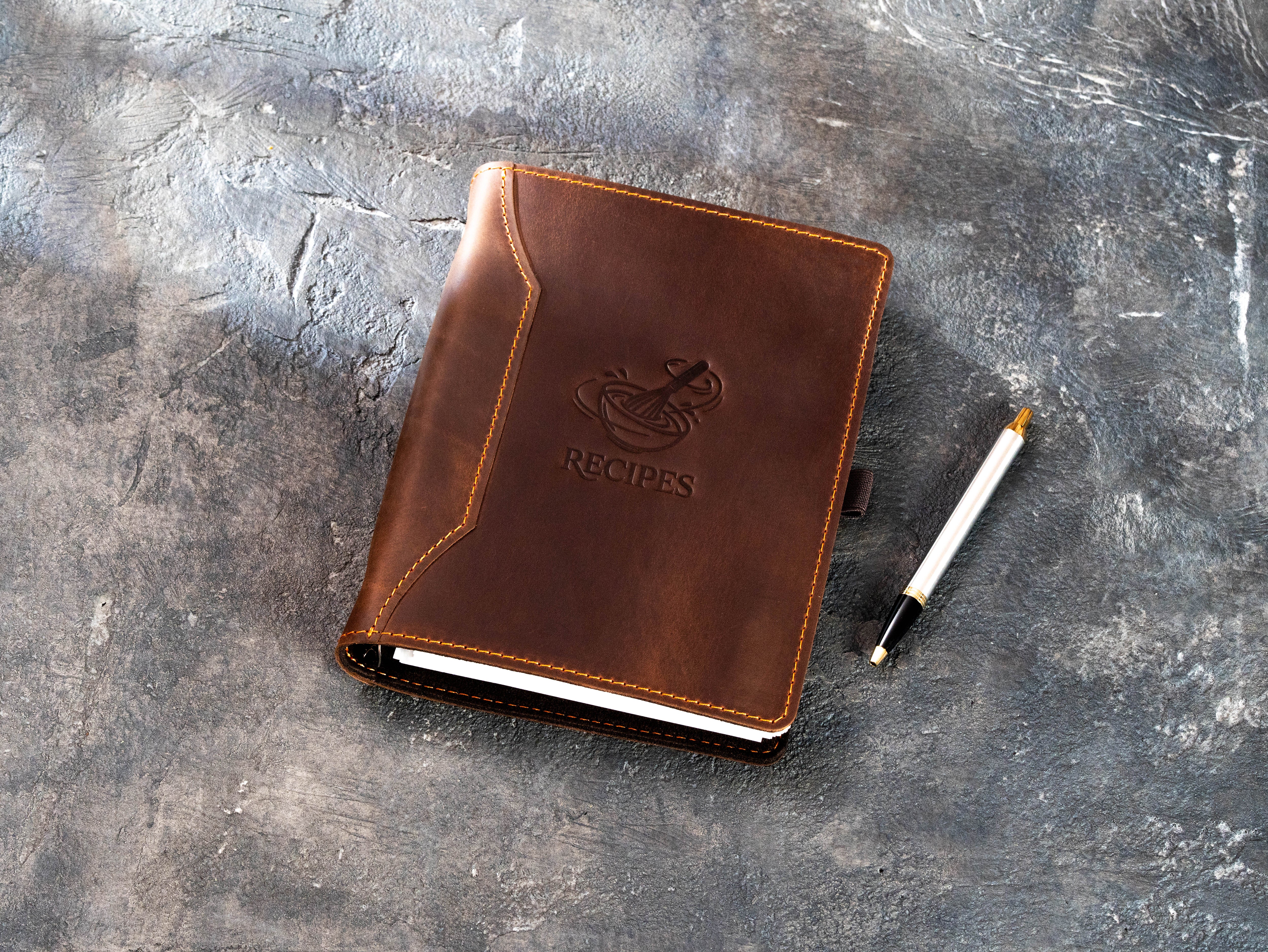 handmade leather recipe organizer with personalized text, pen loop, and decorative stitched cover