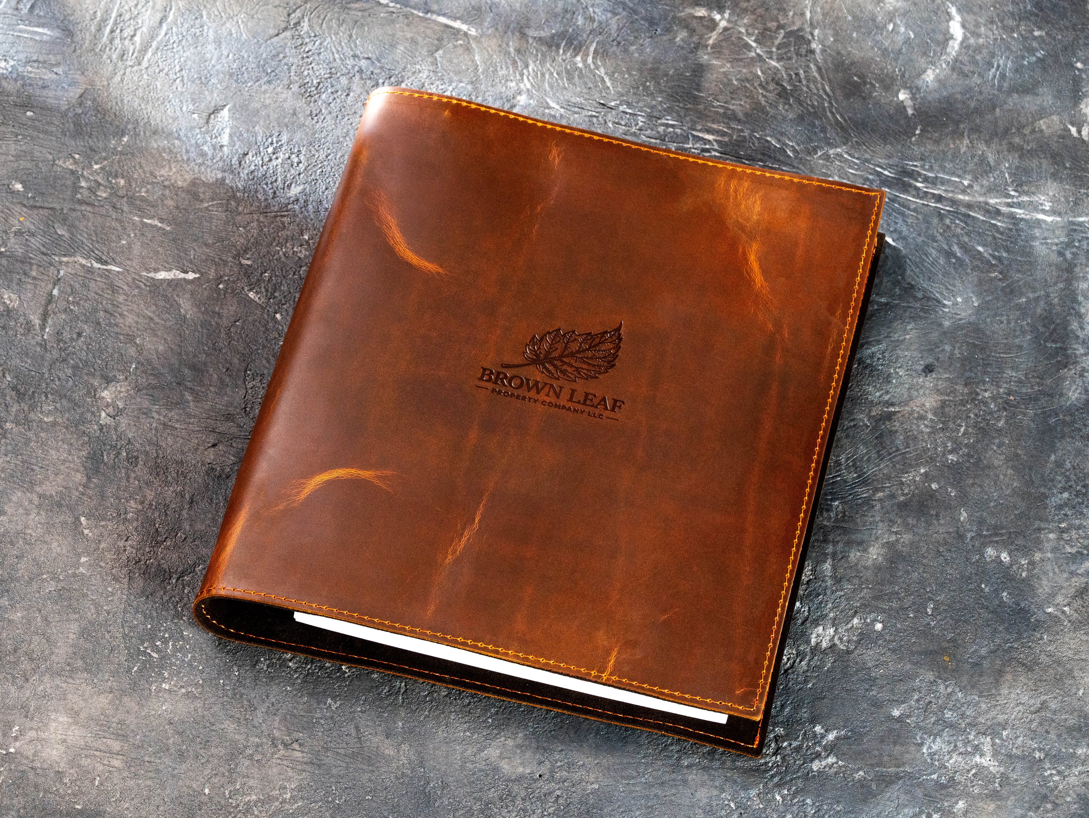 Custom chestnut leather corporate 3-ring binder with Brown Leaf Property Company LLC logo