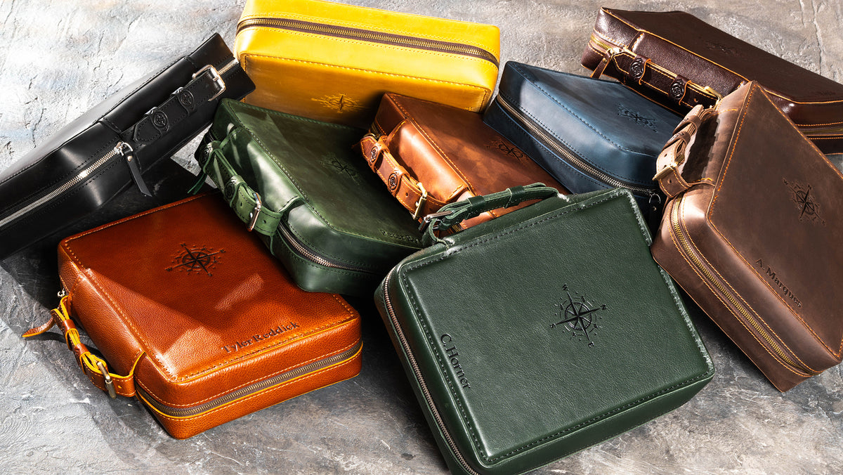 Personalized leather zippered travel organizer cases for men in multiple colors with compass embossing and custom names