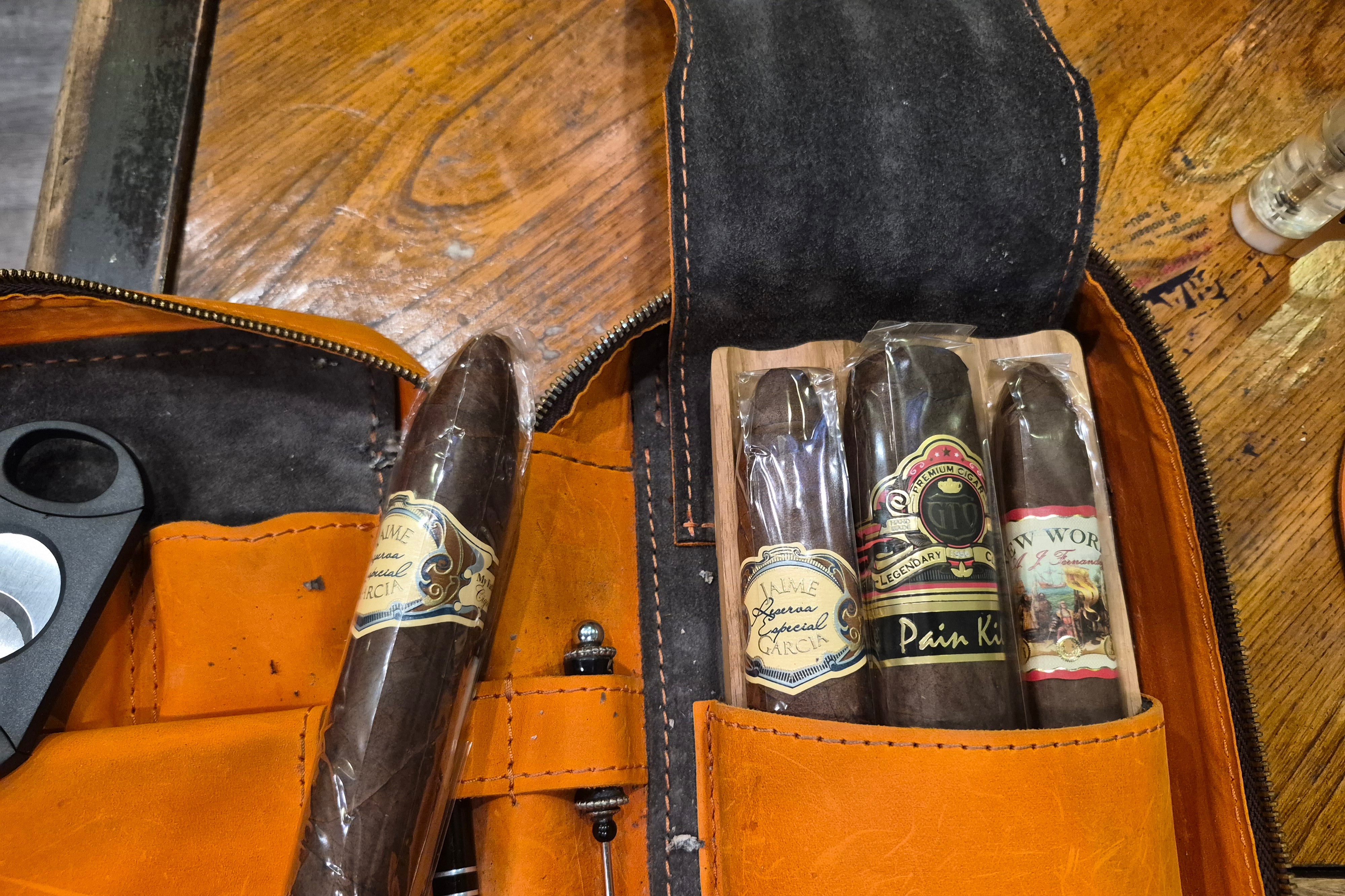 Order #38 One Orange Cigar Case that holds three Cigars with Logo attached to Cigar Case and Drink Coasters and Keychain