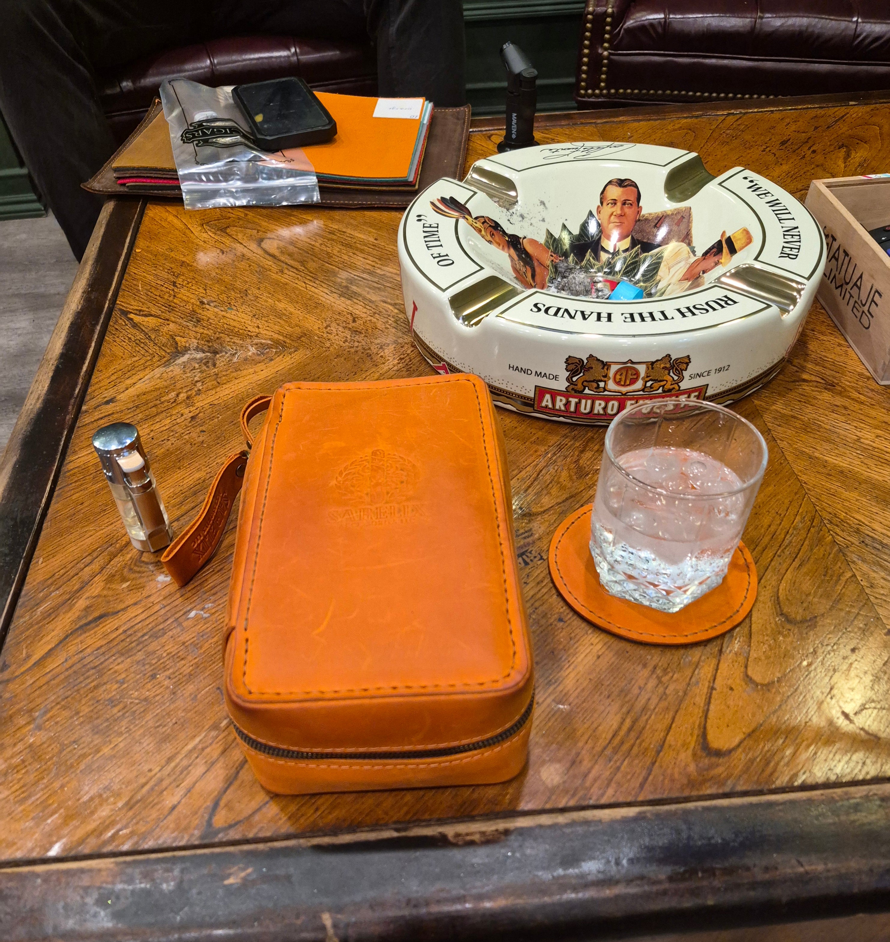 Order #38 One Orange Cigar Case that holds three Cigars with Logo attached to Cigar Case and Drink Coasters and Keychain