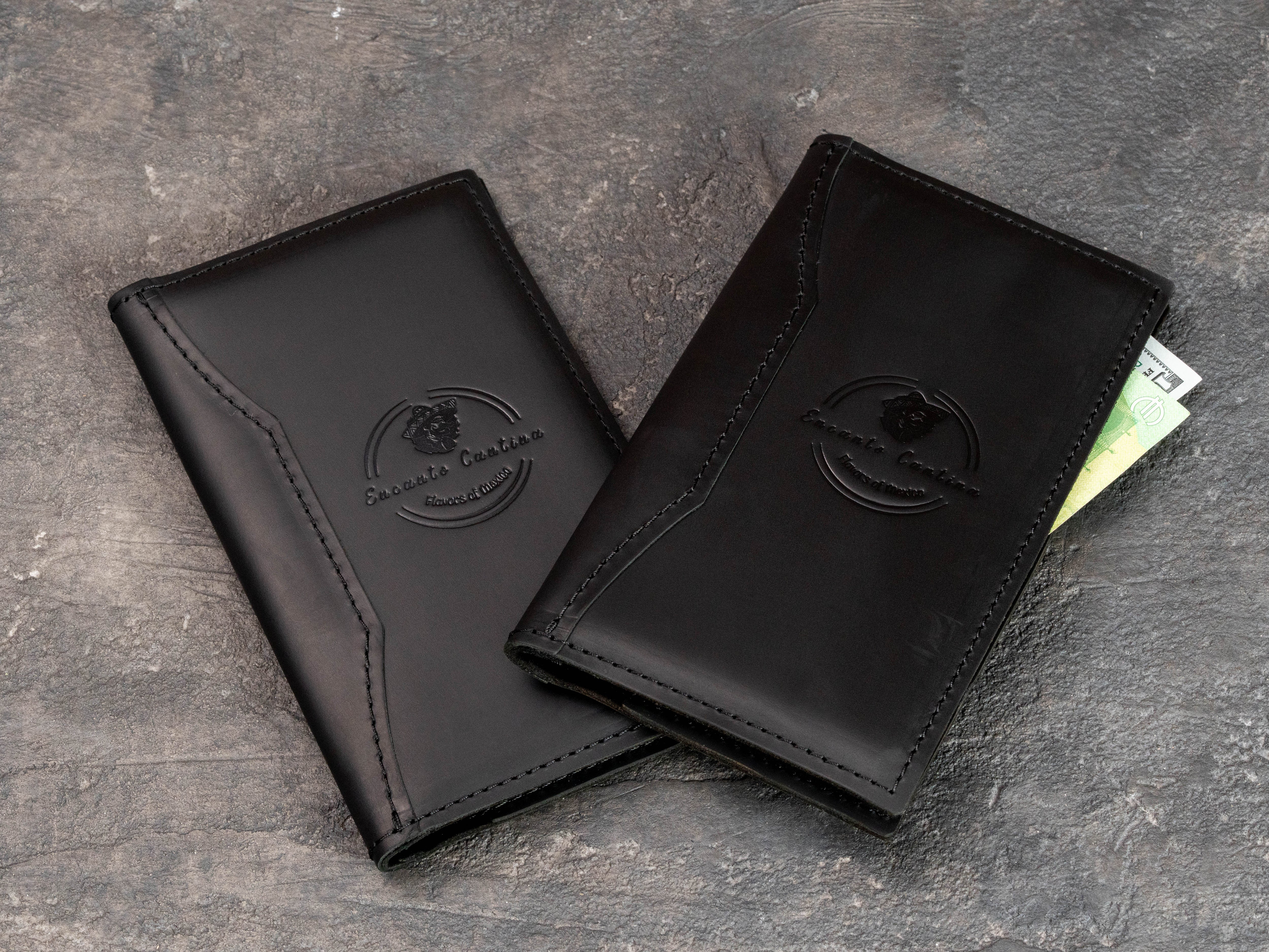 Custom black leather check presenters for Mexican restaurant with tone-on-tone embossed logo
