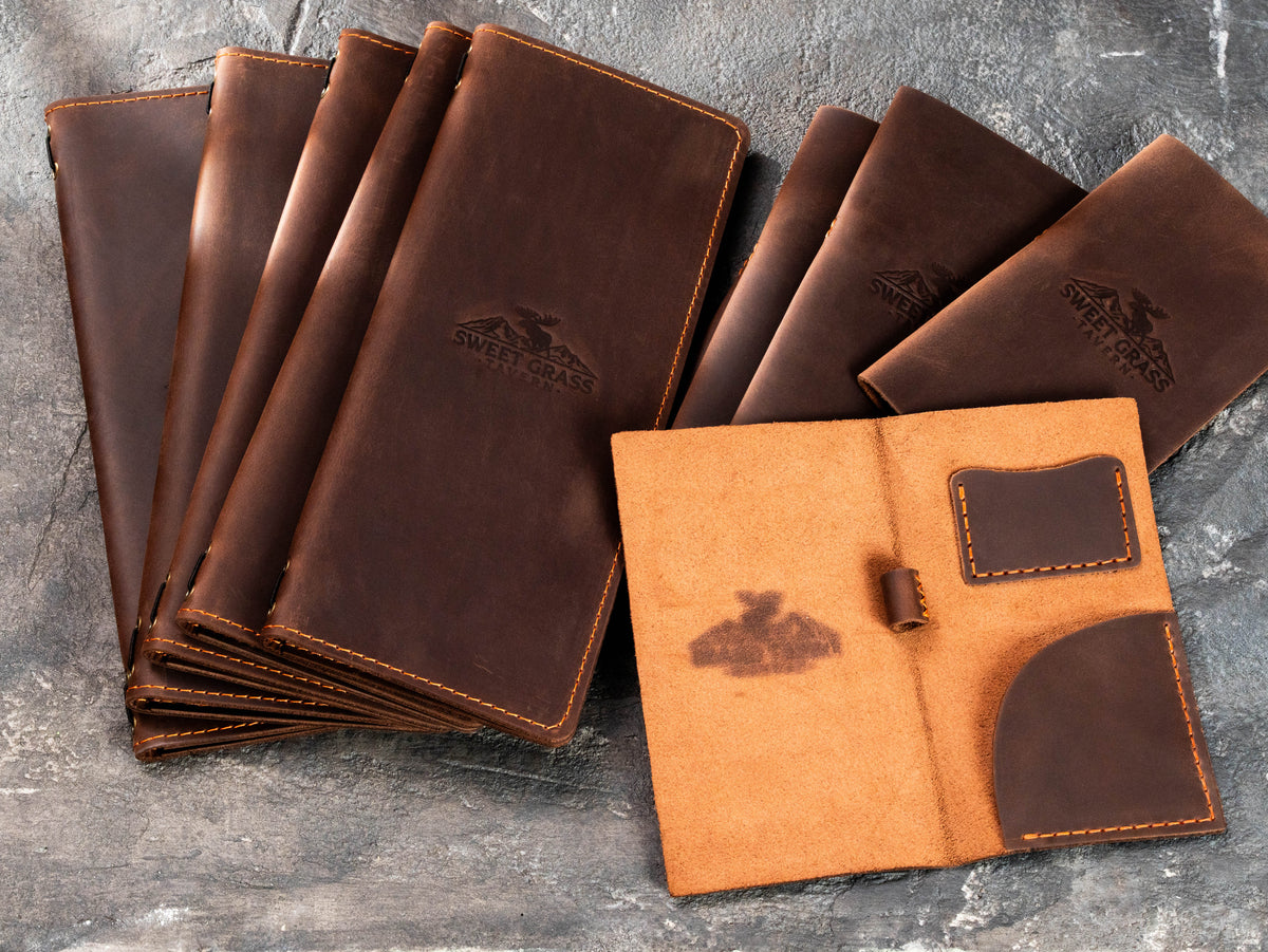 Open leather check presenter with suede interior, card pocket, bill pocket and pen loop for restaurant service