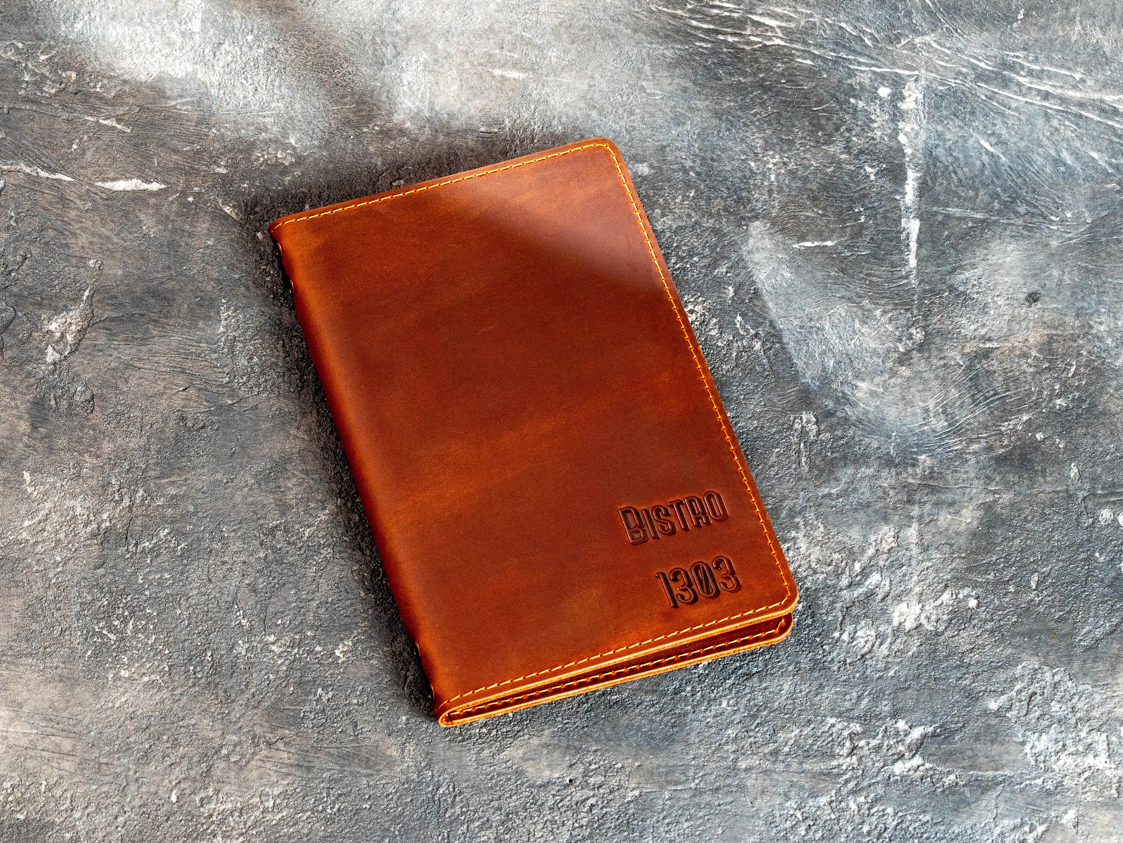 Custom Bistro 1303 leather menu holder in chestnut brown with stitched edges