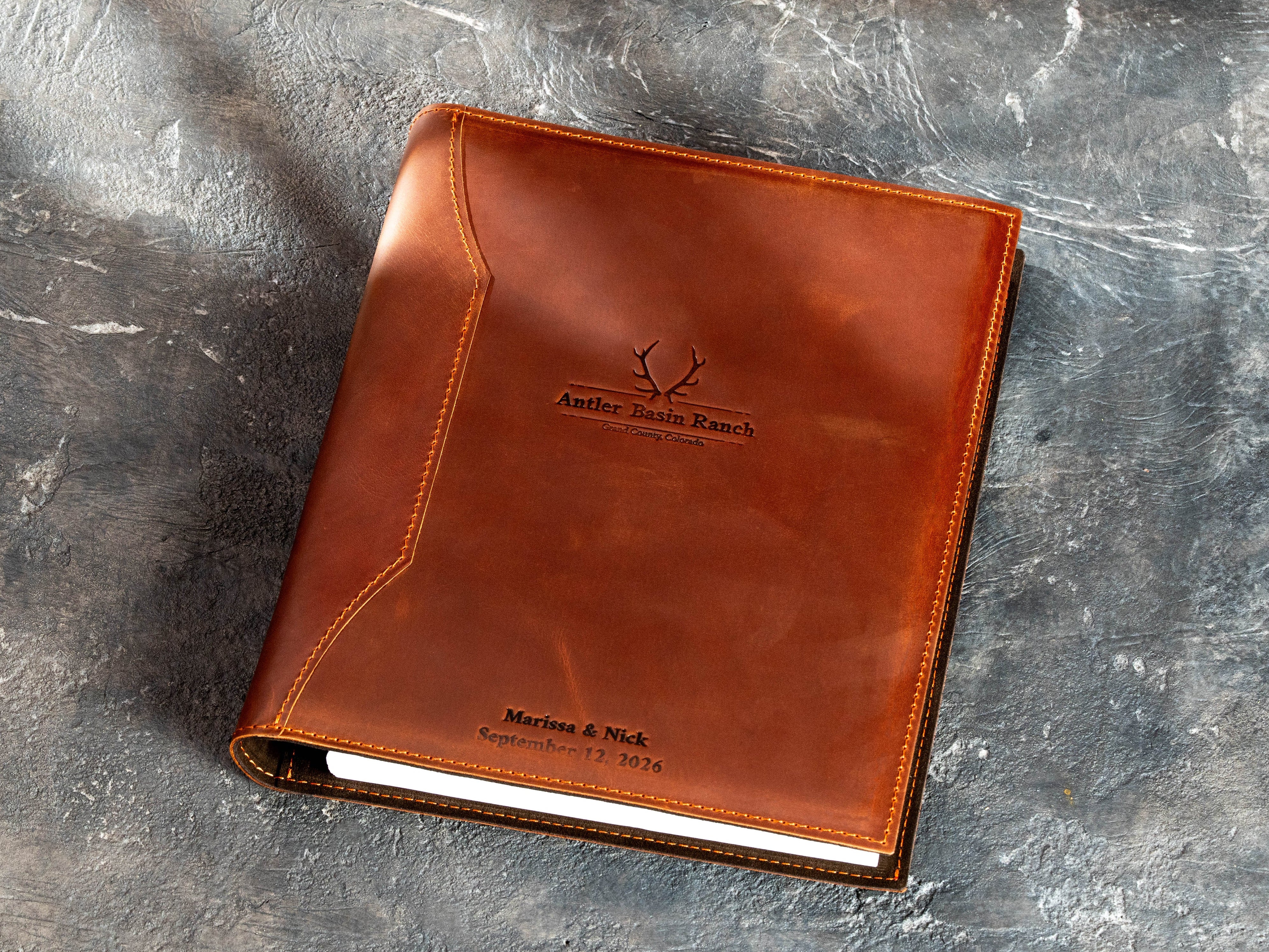 Custom copper leather 3-ring binder with Antler Basin Ranch logo
