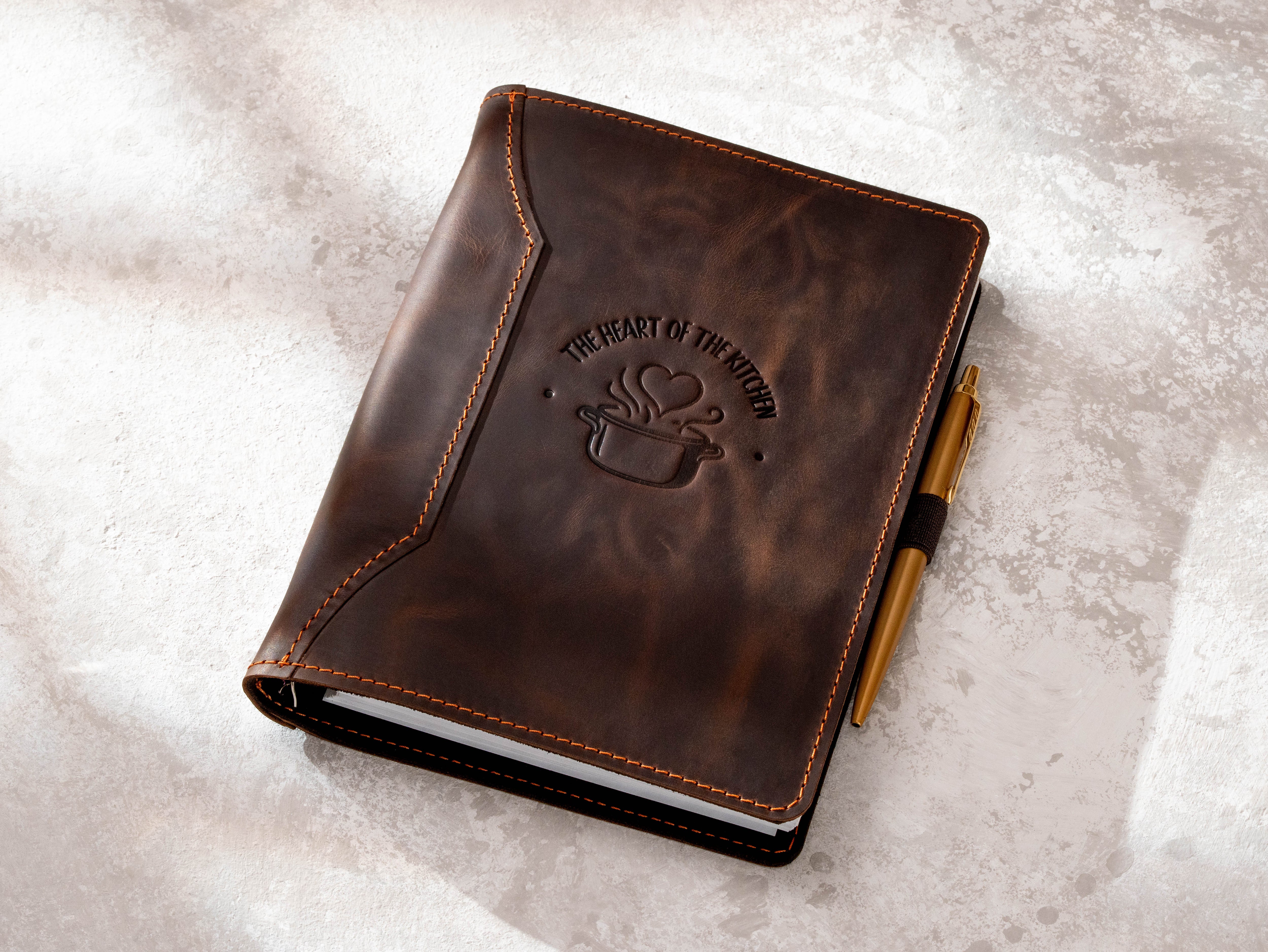 Personalized brown leather recipe organizer with pen loop and embossed kitchen design