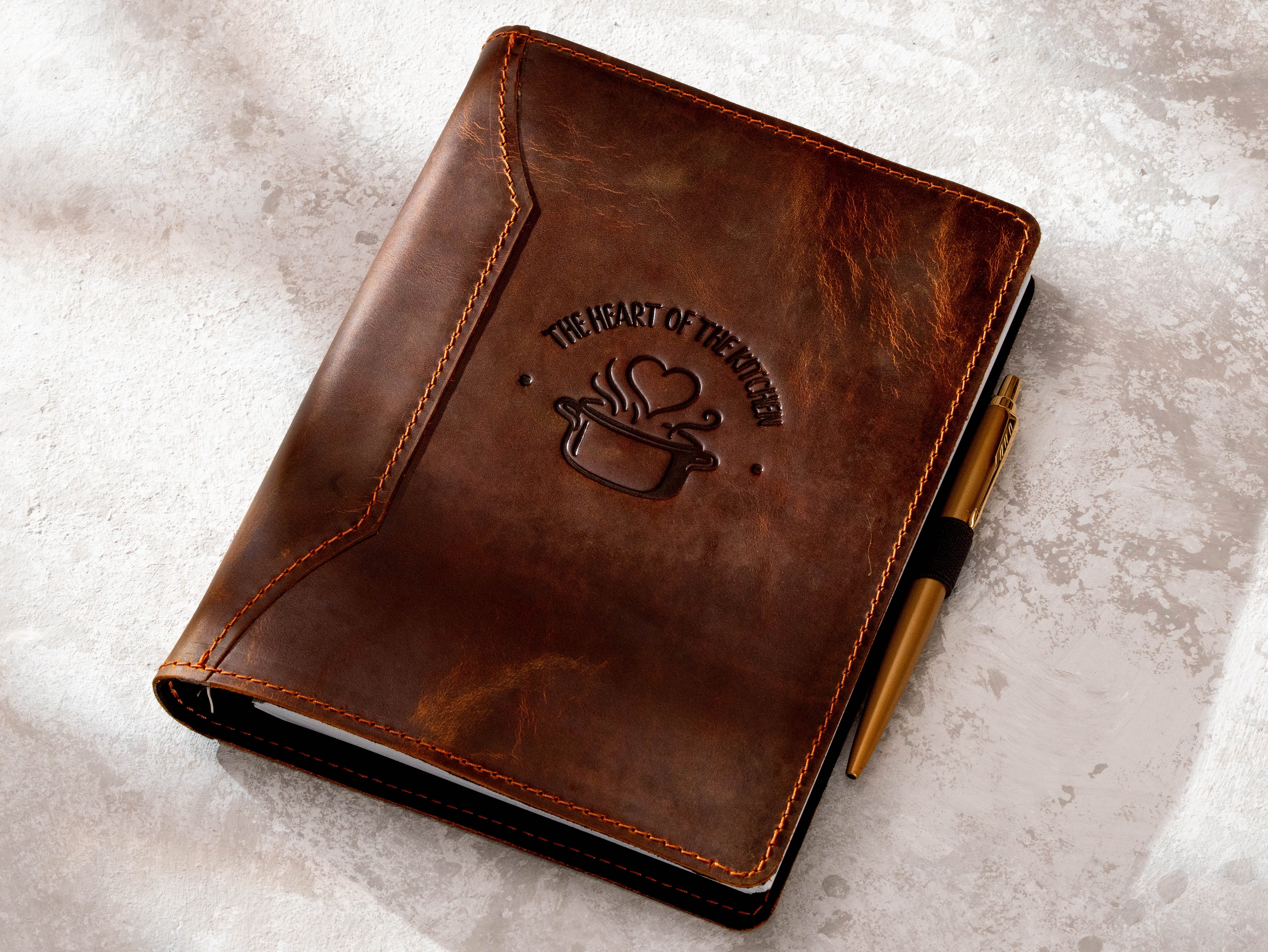 Personalized chestnut leather recipe book with pen loop and fixed The Heart of the Kitchen cover design