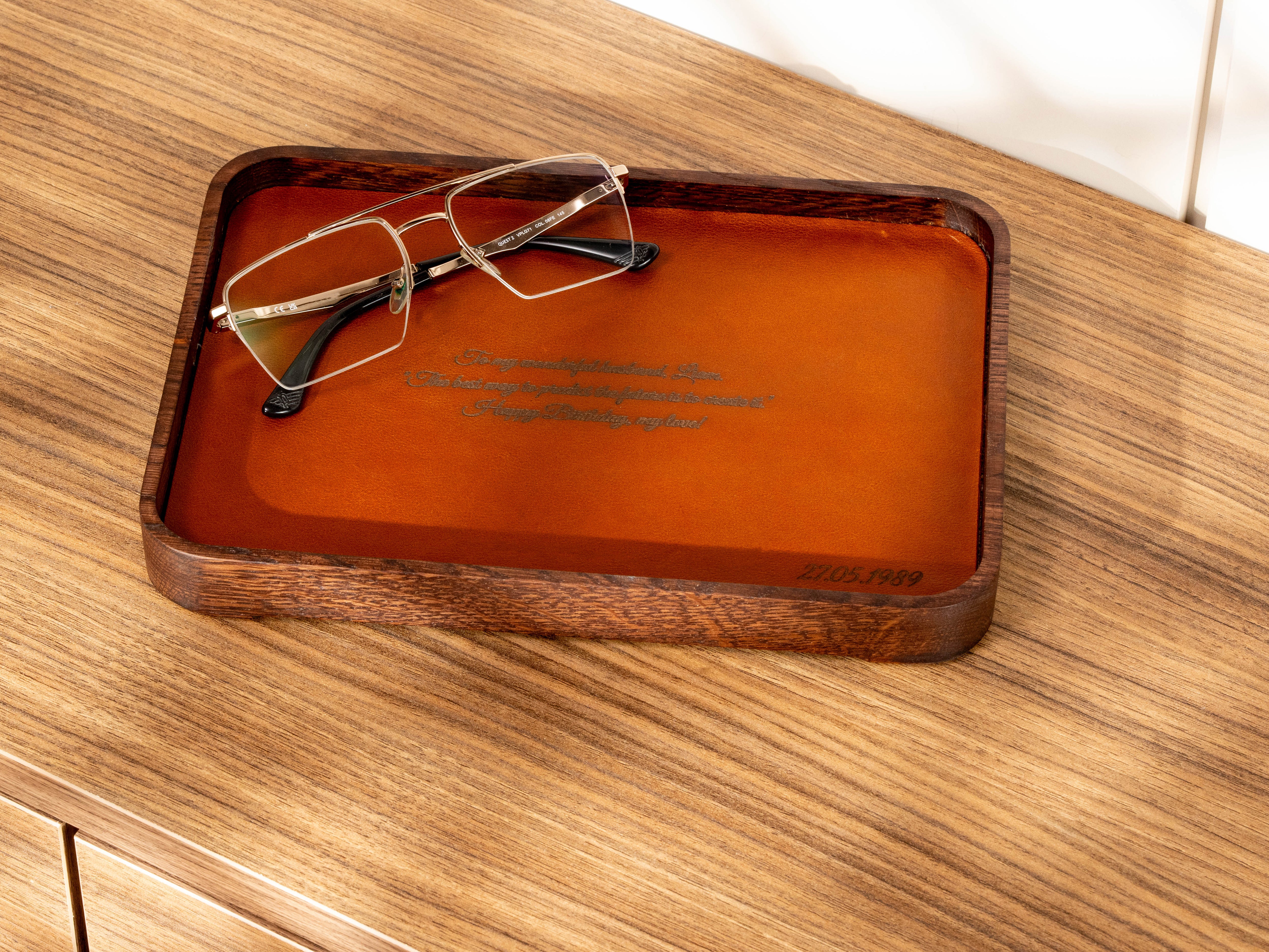 Custom engraved Camel leather valet tray with oak wood frame, glasses and personalized message with date.