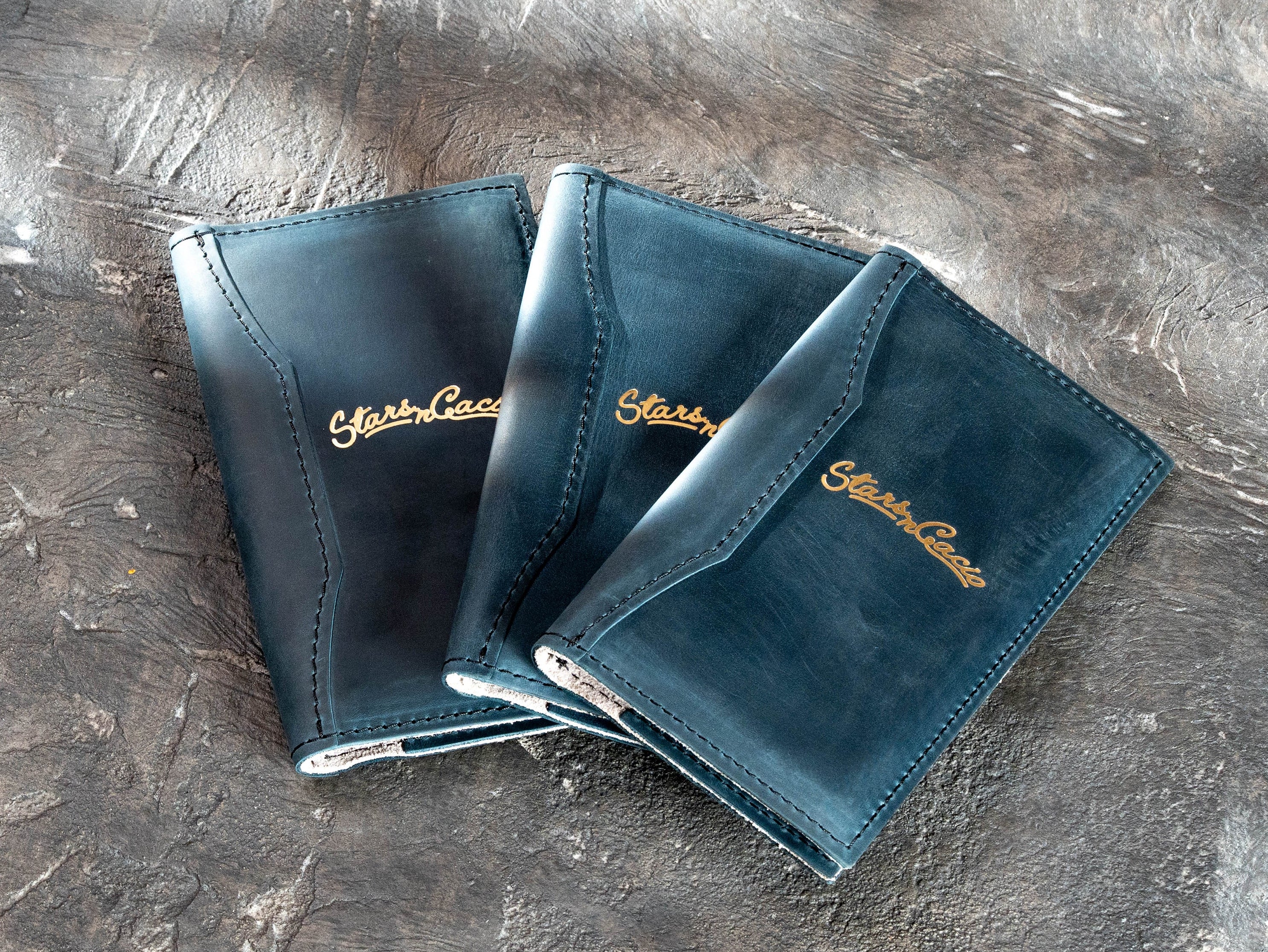 Custom Blue Crazy Horse leather bill holders made for Star in Cacio with gold foil logos