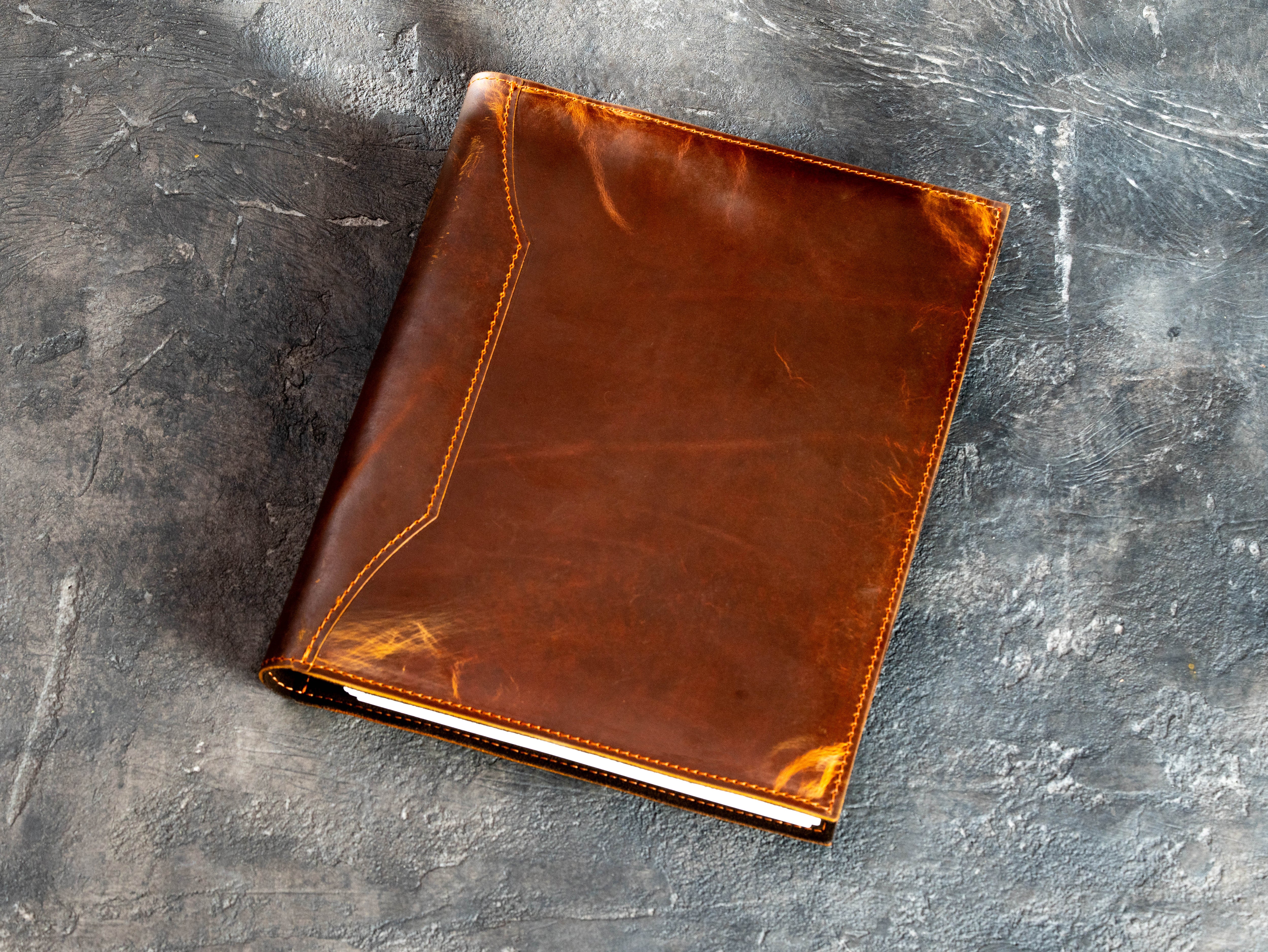 Closed Chestnut Crazy Horse leather car document binder with decorative stitched panel and natural vintage markings
