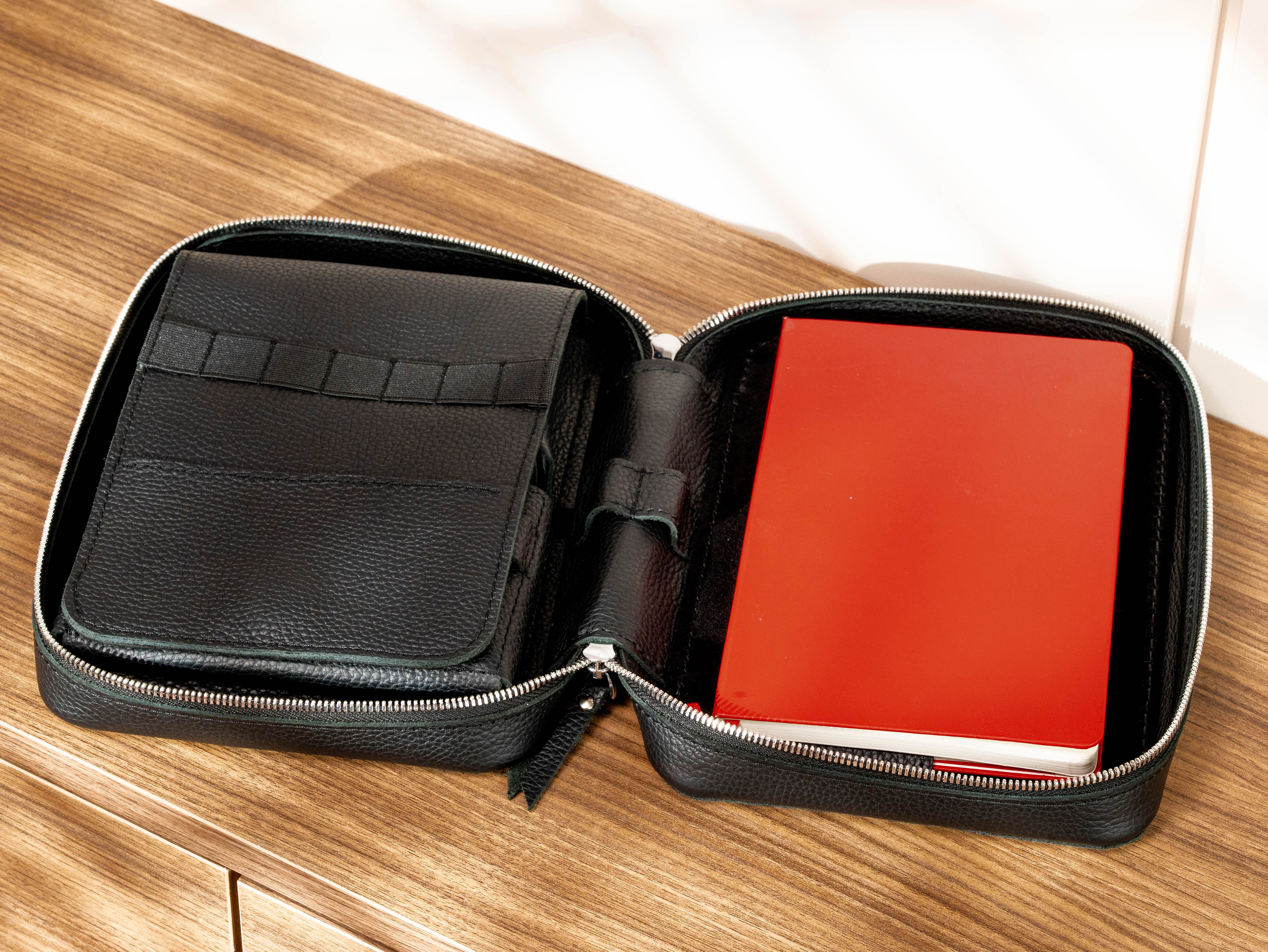 Open leather artist organizer with A5 notebook, pencil storage and interior art supply compartments