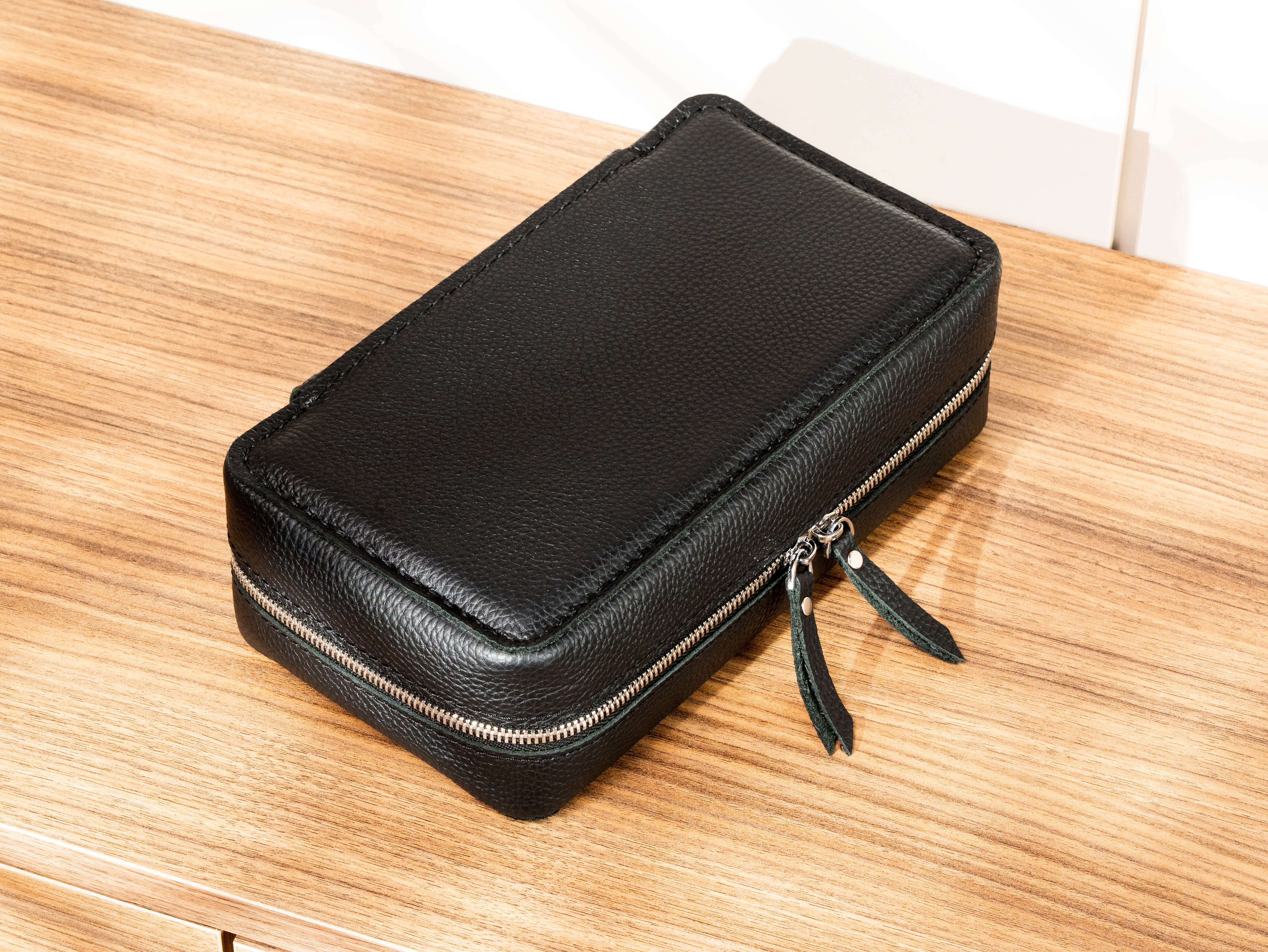 Black Floater leather lightweight travel cigar case with full zipper closure and structured protective design