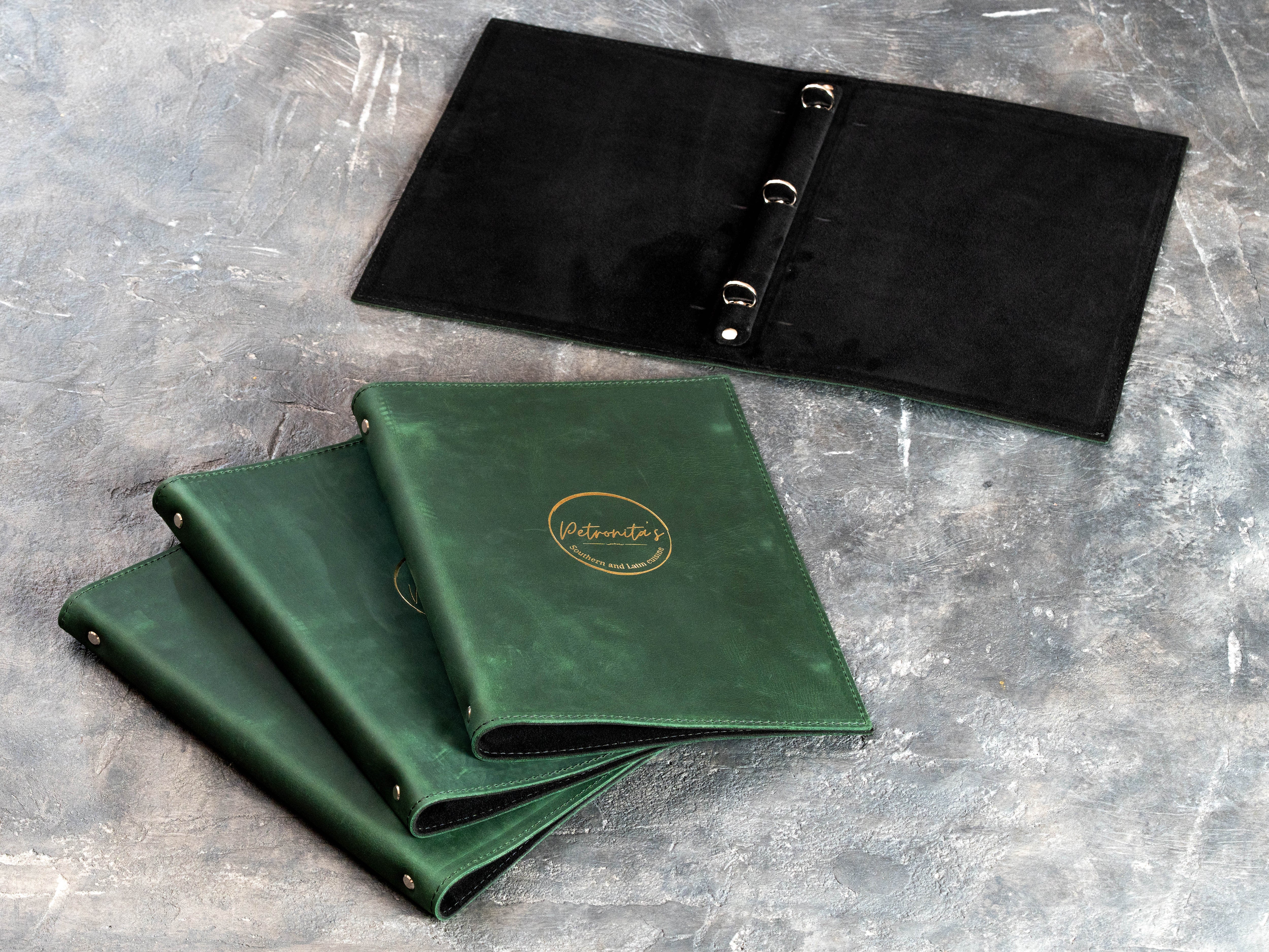 Custom Green Restaurant Menu Binder with Gold Foil Logo and Black Suede Interior | Mureli