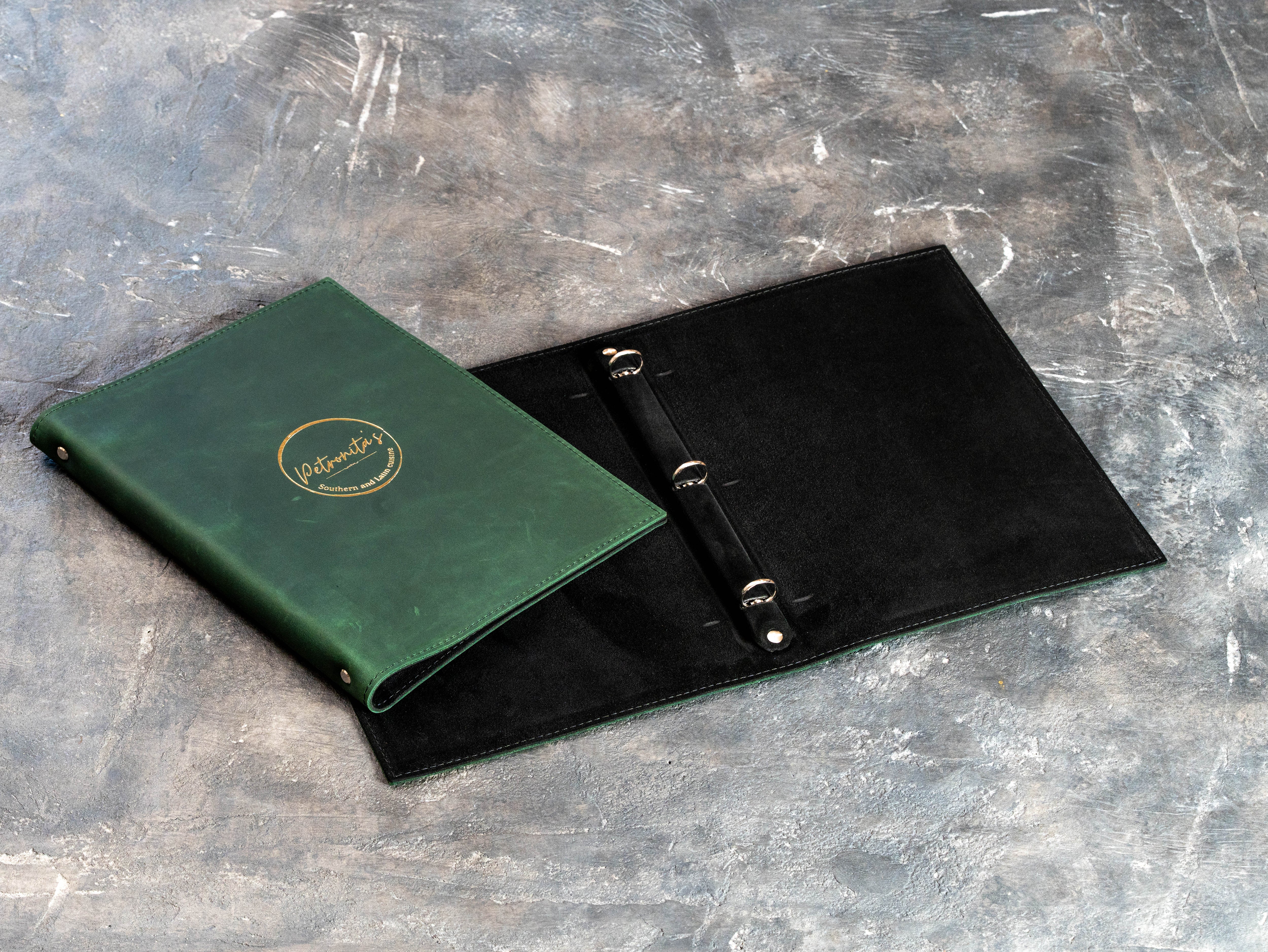 Custom Green Restaurant Menu Binder with Gold Foil Logo and Black Suede Interior | Mureli