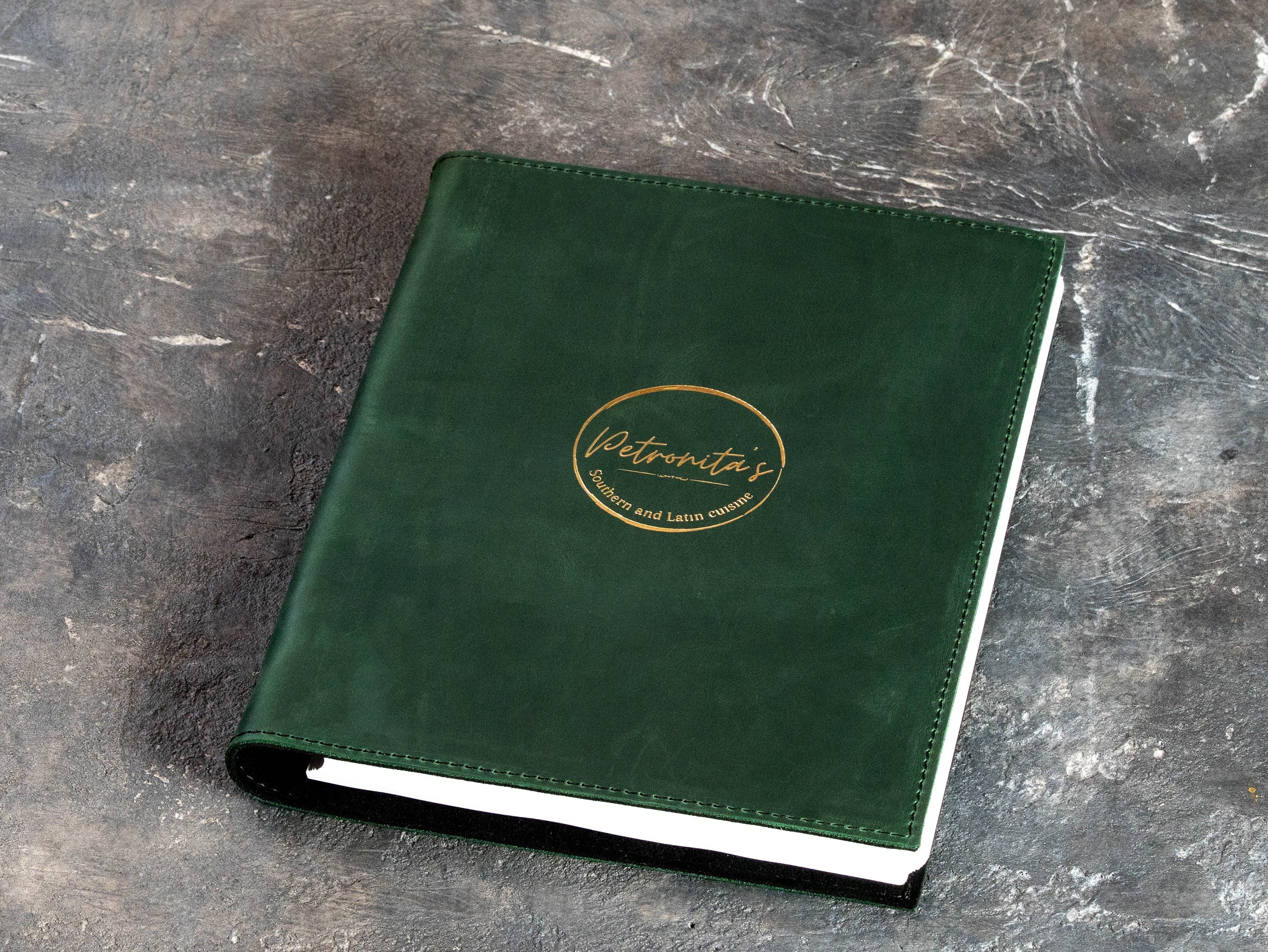 Custom Green Restaurant Menu Binder with Gold Foil Logo and Black Suede Interior | Mureli