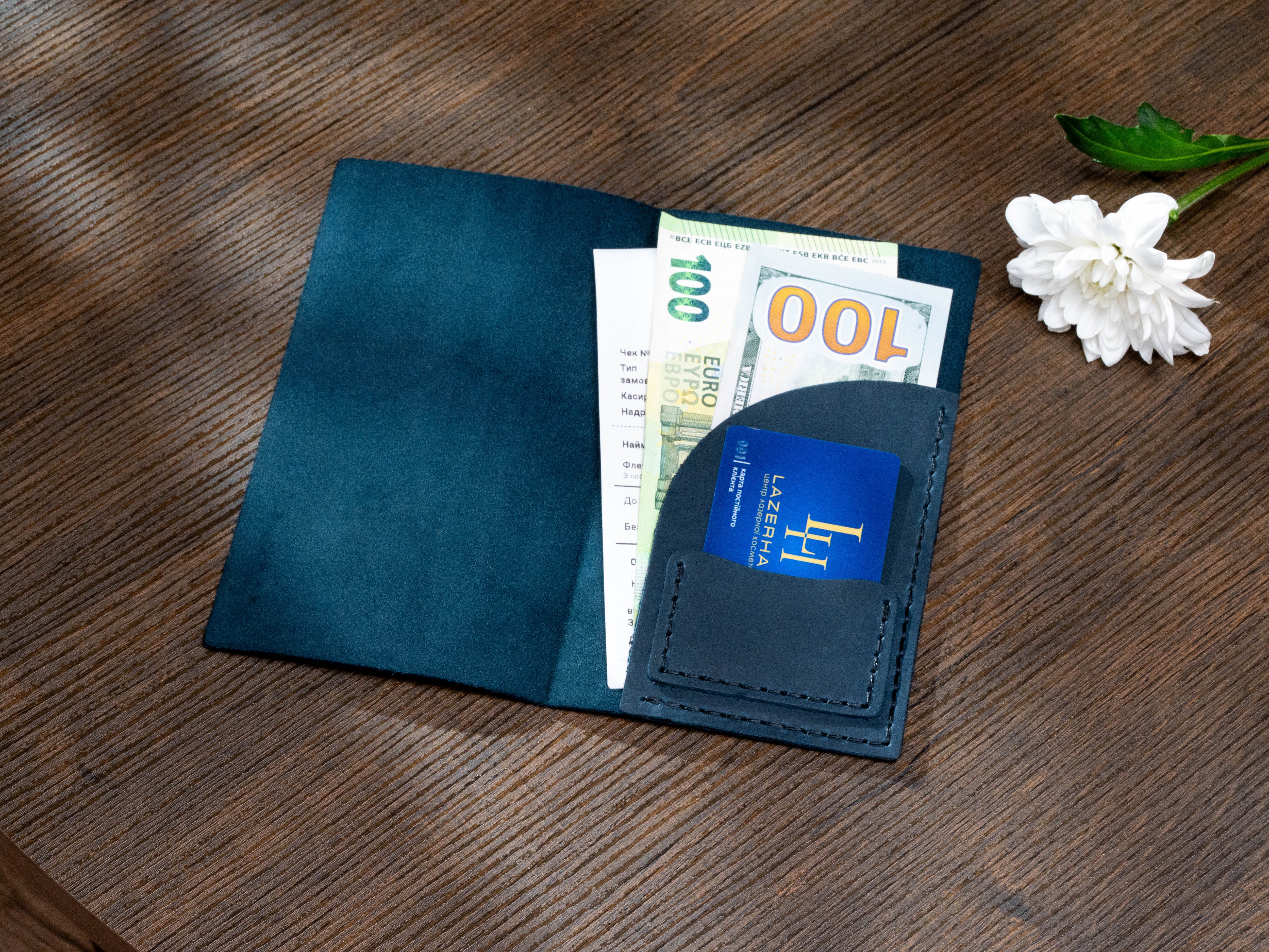 Open navy leather check presenter with suede interior, receipt pocket, cash and dedicated payment card slot