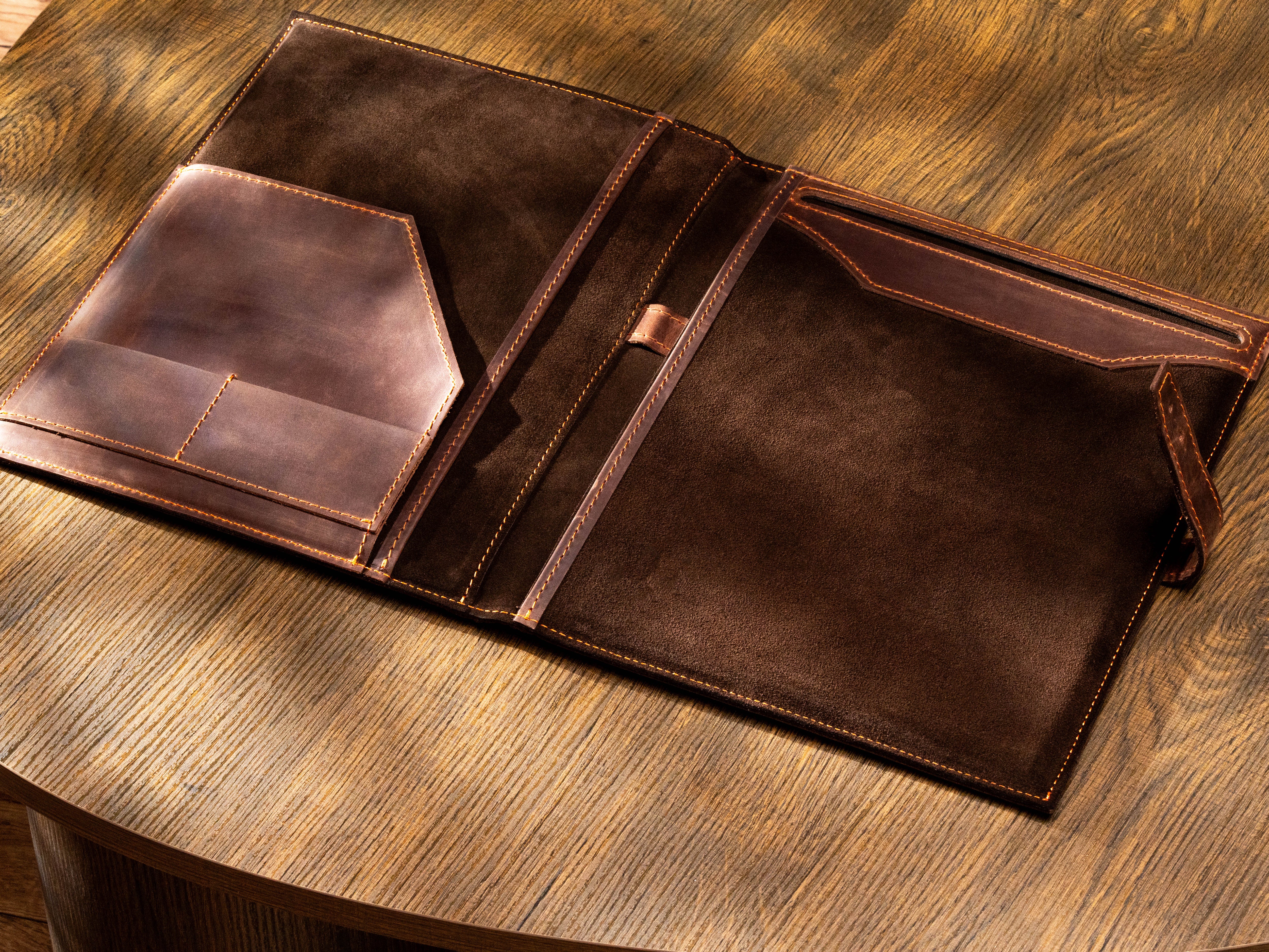 A dark brown leather document holder