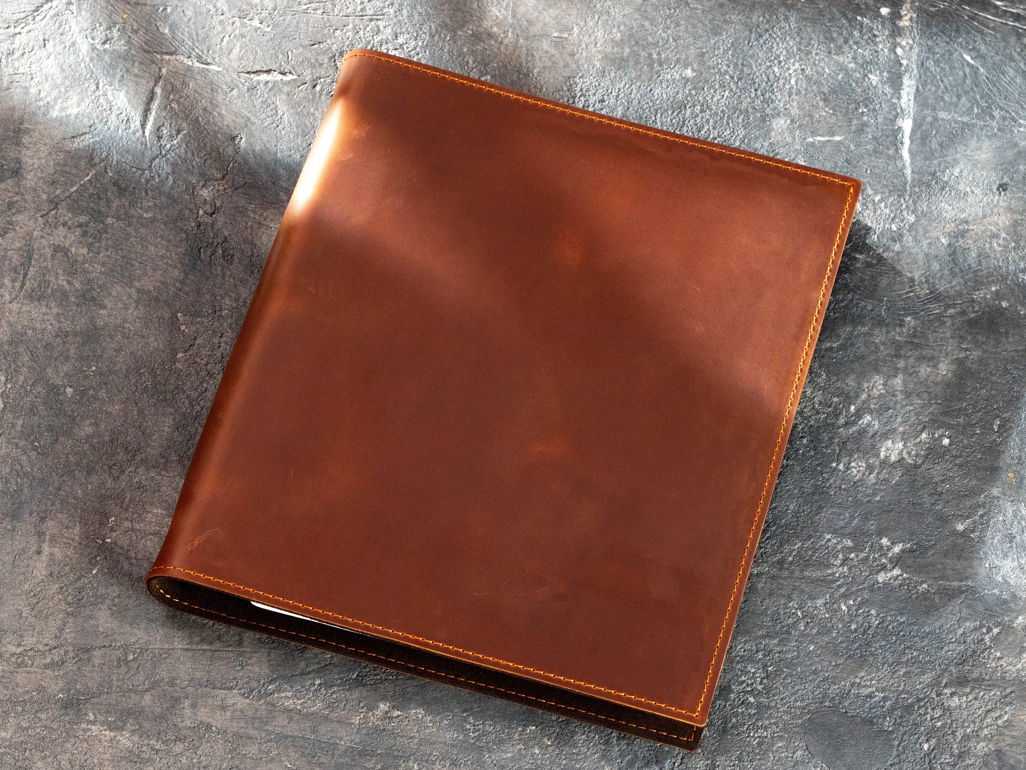 Closed Copper leather document binder without personalization, showing natural leather texture and stitched edges