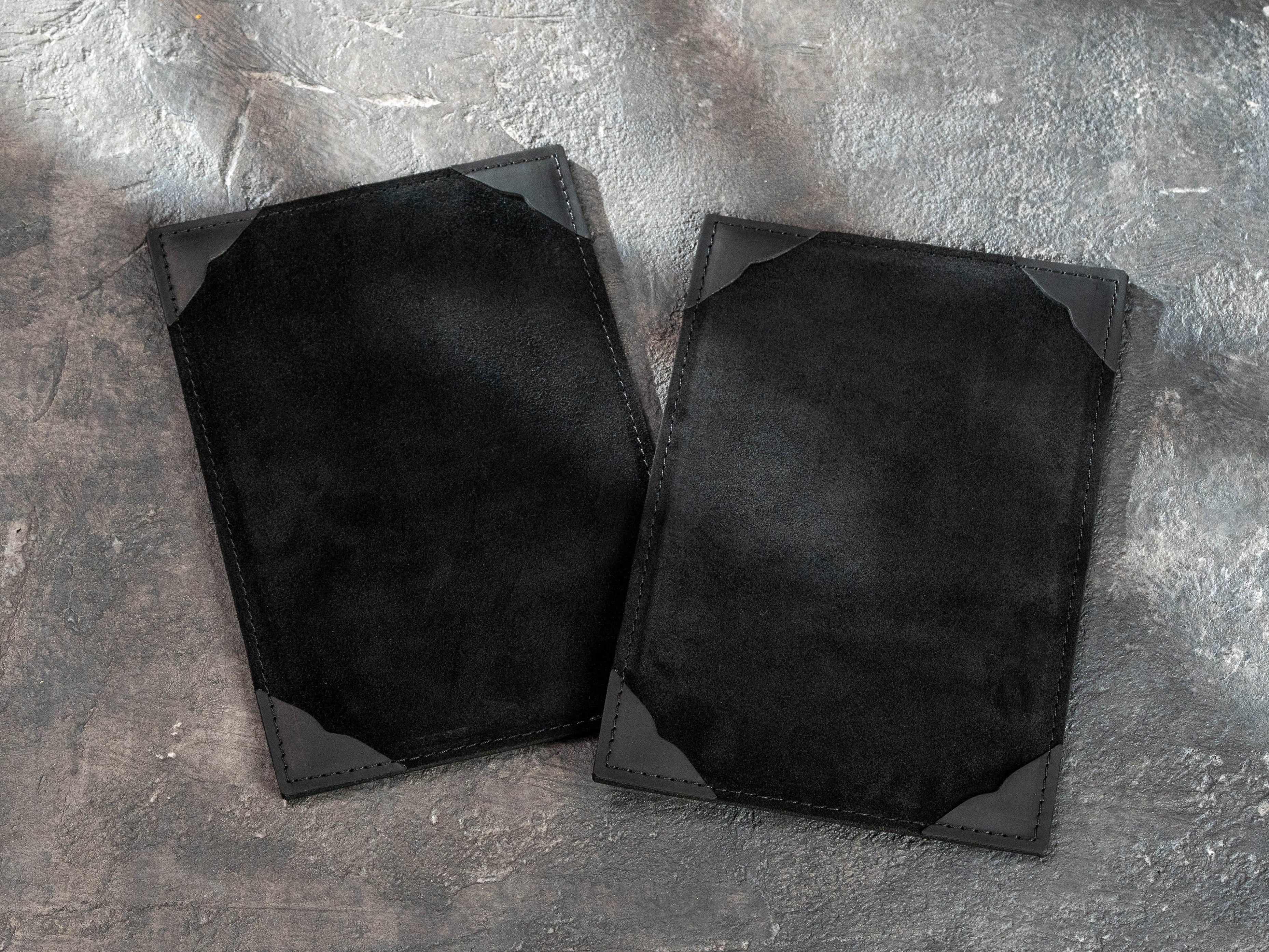black leather A5 menu boards with soft suede surfaces and four corner holders for replaceable menu sheets