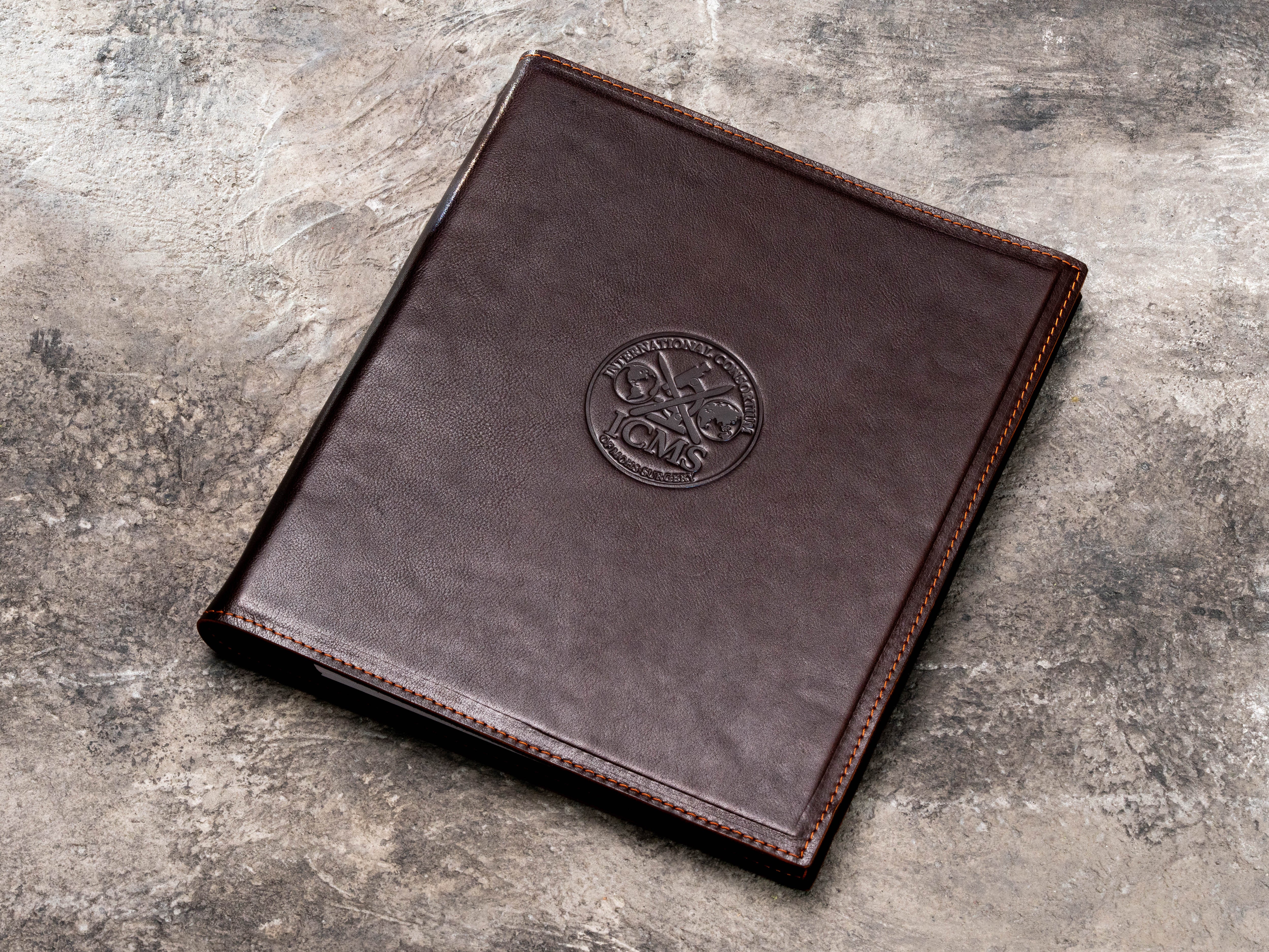 Dark brown leather 3-ring binder for quantity surveyors and construction cost management documents