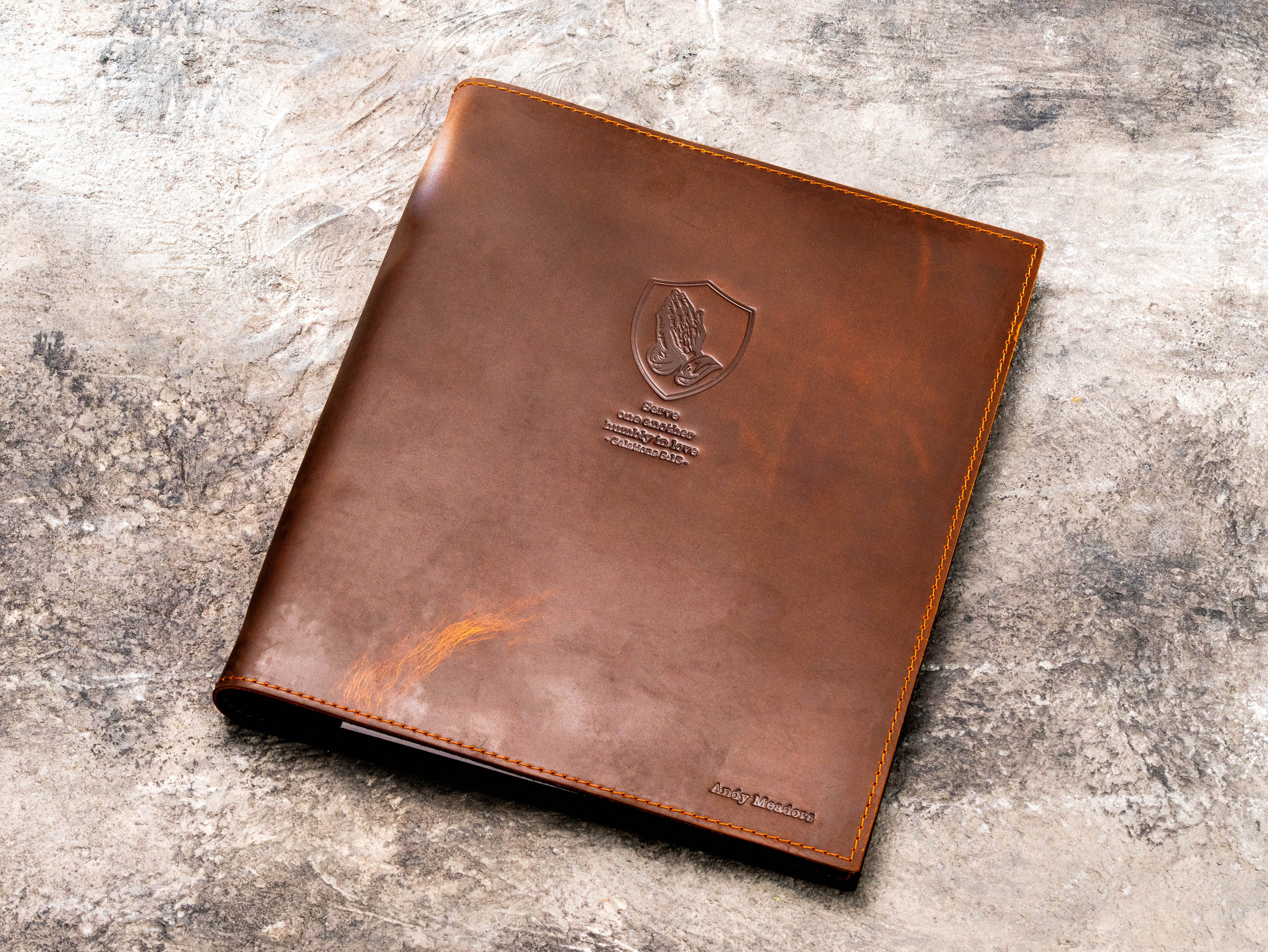 Brown leather ministry folder personalized for a pastor with faith-inspired blind embossed design