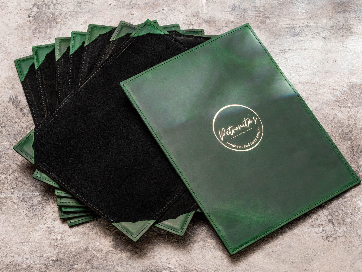 Custom green leather 8.5 x 11 restaurant menu board with black suede leather back and gold Petronita’s logo
