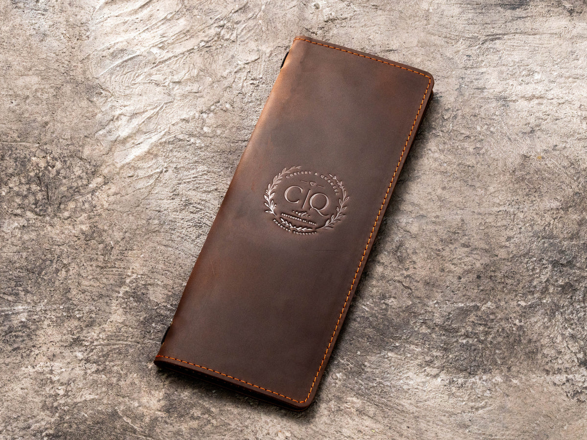 Personalized brown leather wedding menu cover with custom monogram and contrast stitching