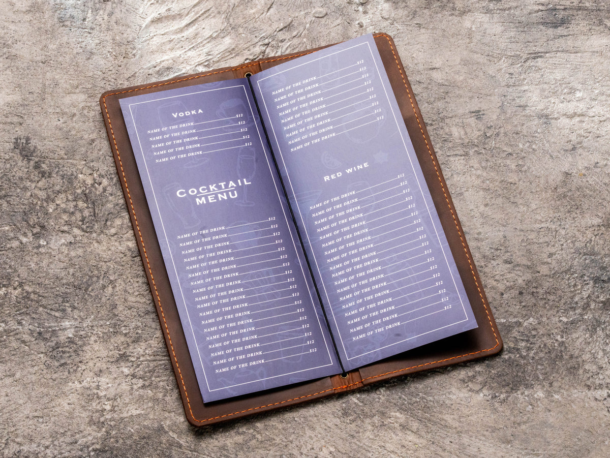Brown leather home bar menu folder holding a folded cocktail and wine menu