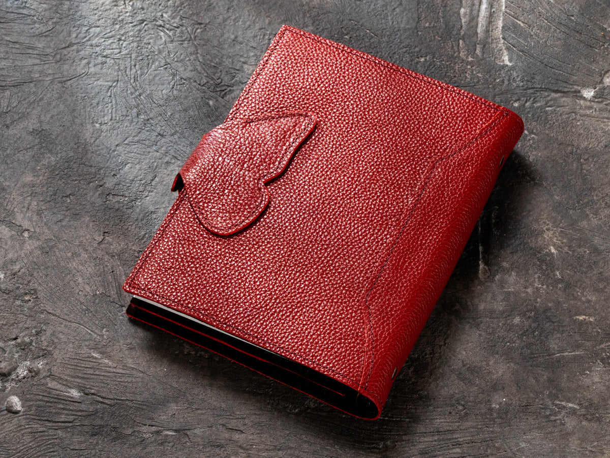 Back view of red Floater leather corporate ring binder notebook with butterfly wing closure