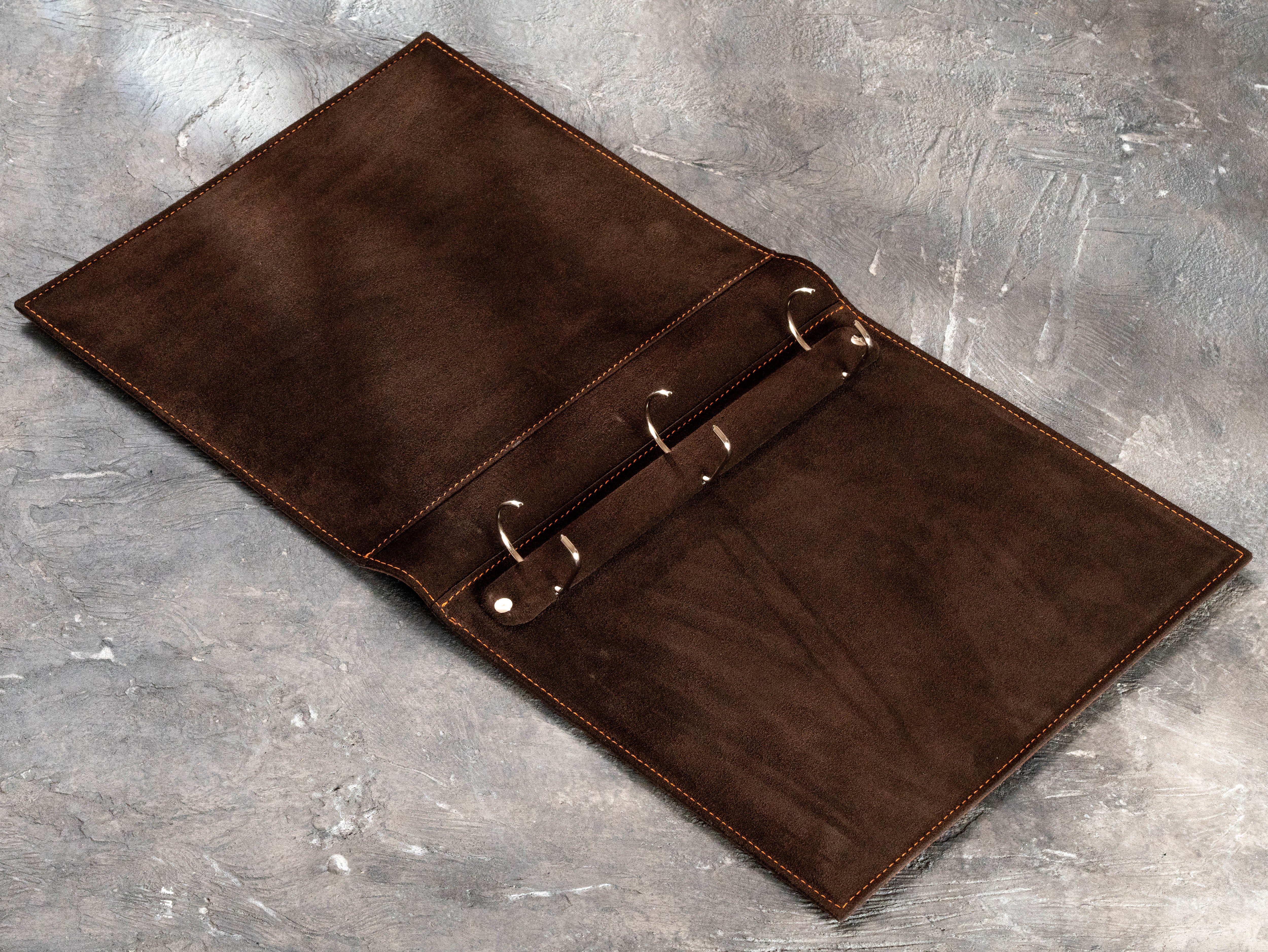 1.5-inch D-ring mechanism inside brown leather corporate binder for financial and CPA office documents